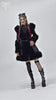 Gothic black faux leather coat with fur trim, showcasing punk style and edgy fashion for women.