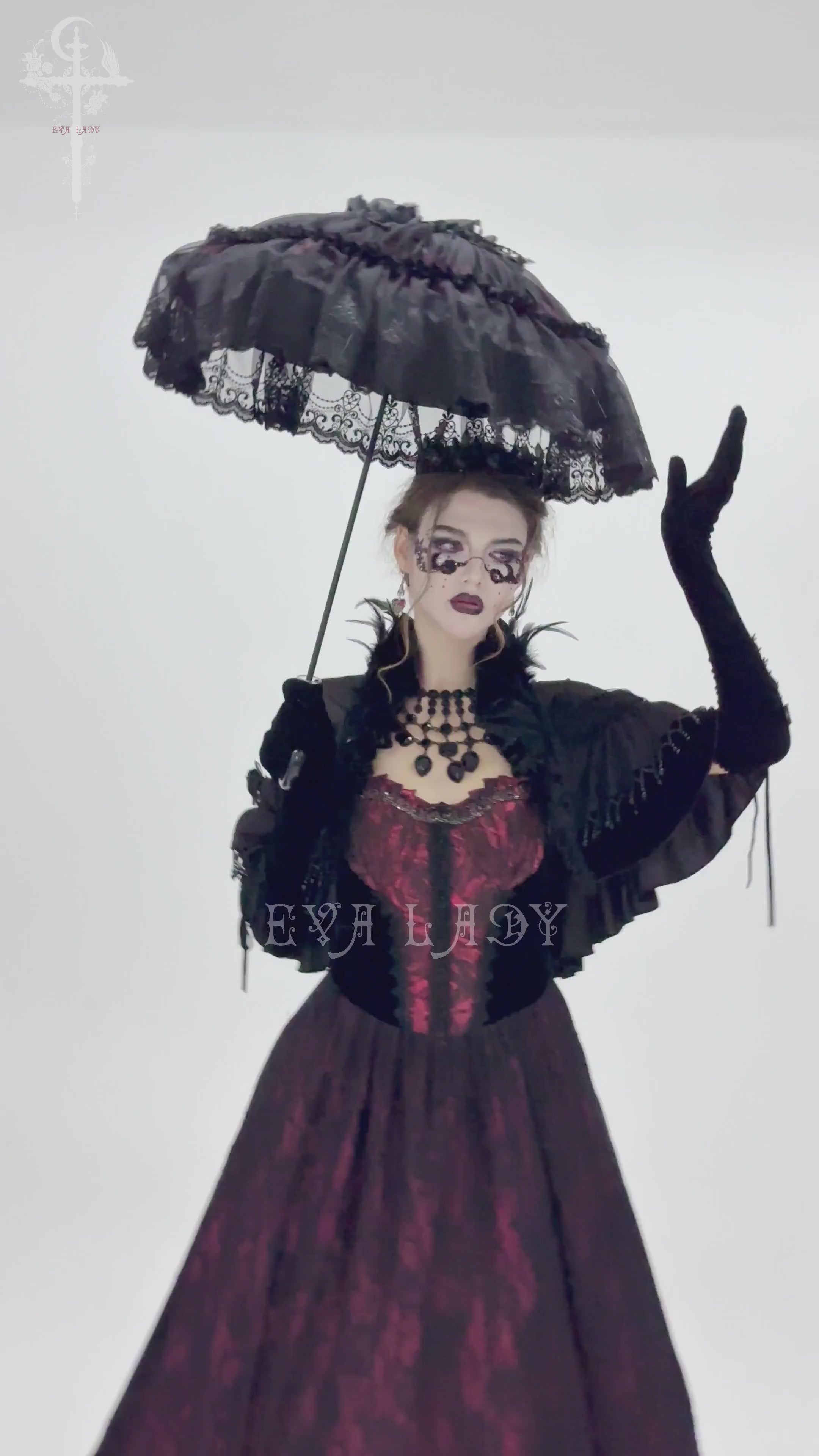 Elegant model showcasing a Gothic lace fringe umbrella, adorned with roses, perfect for dramatic vintage-inspired looks.