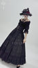 Gothic black maxi skirt with lace overlay and corset waist, styled for a Victorian-inspired look.