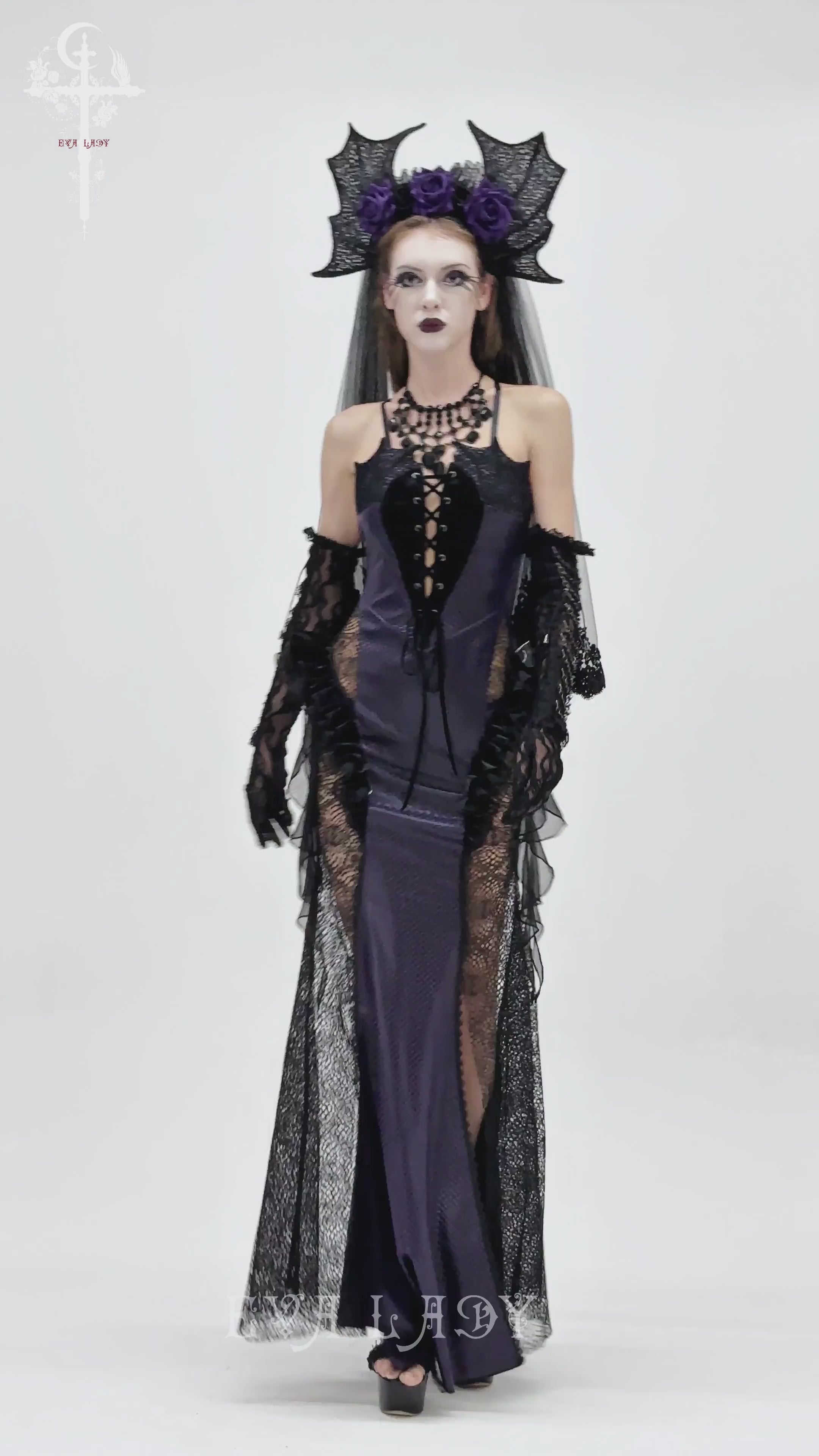 Purple Gothic Lace-Up Dress with Black Ruffle Tulle on a model, featuring ruffled tulle and a dramatic lace-up design.
