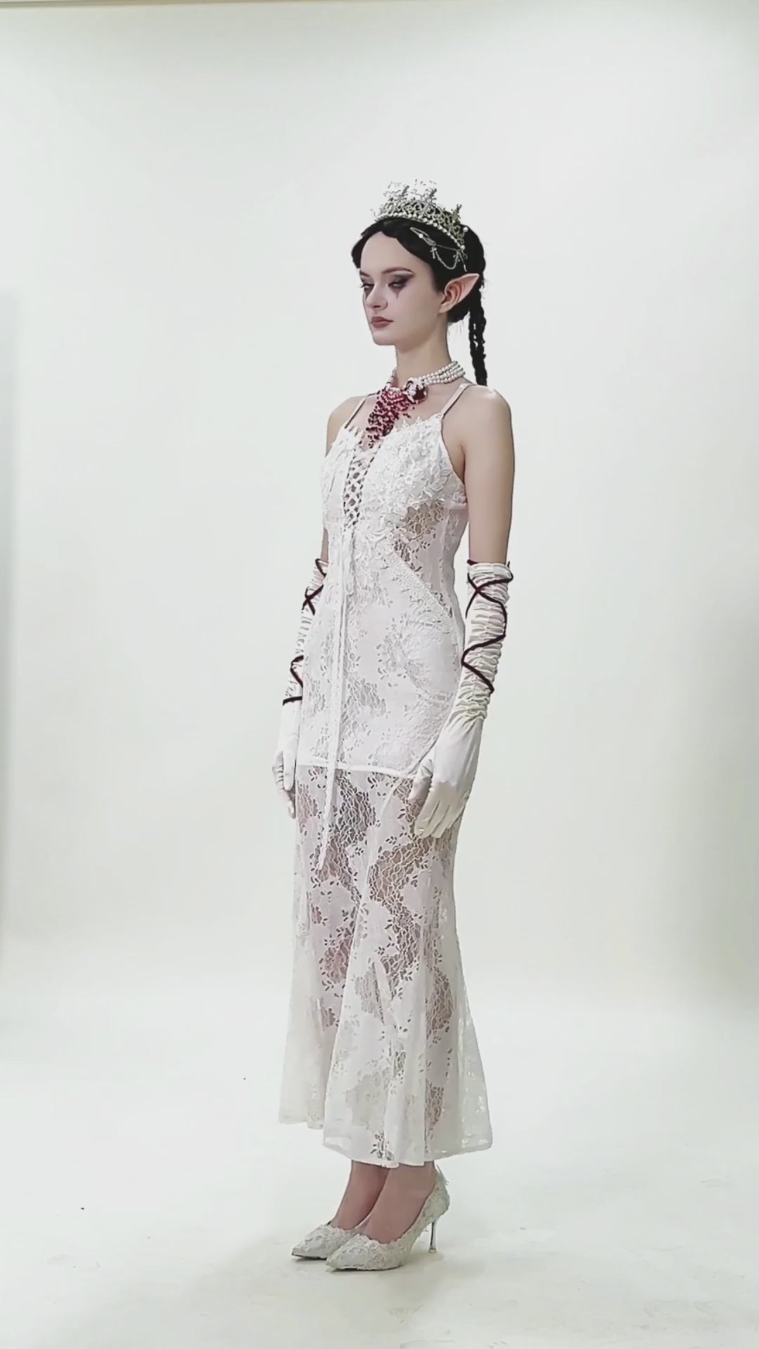 Elegant White Lace Gothic Dress with Spaghetti Straps worn by a model, showcasing intricate lace detailing and vintage style.