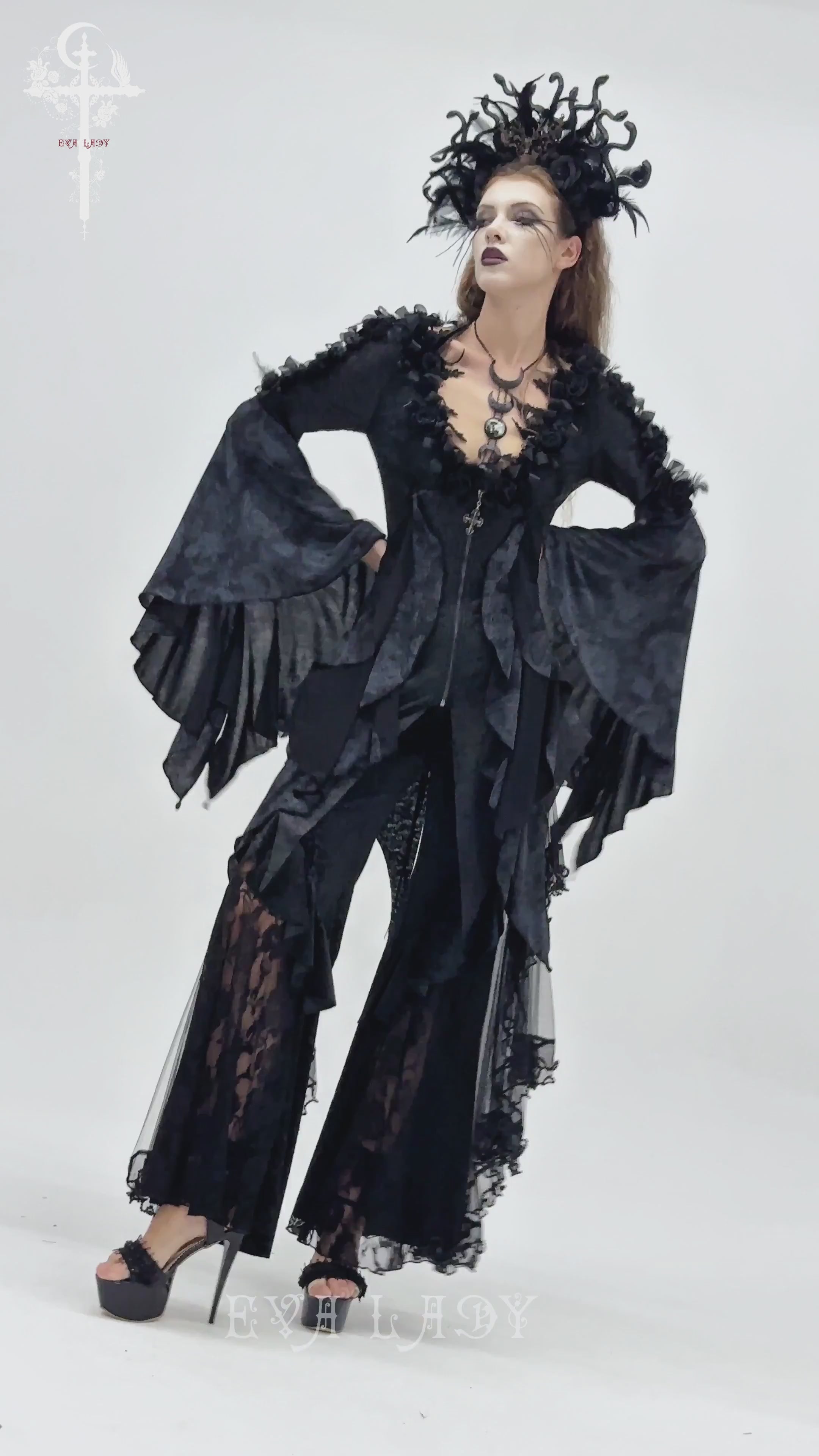 Edgy Lace-Up Blouse with Rose Trim and Bell Sleeves worn by a model with dramatic makeup and accessories.