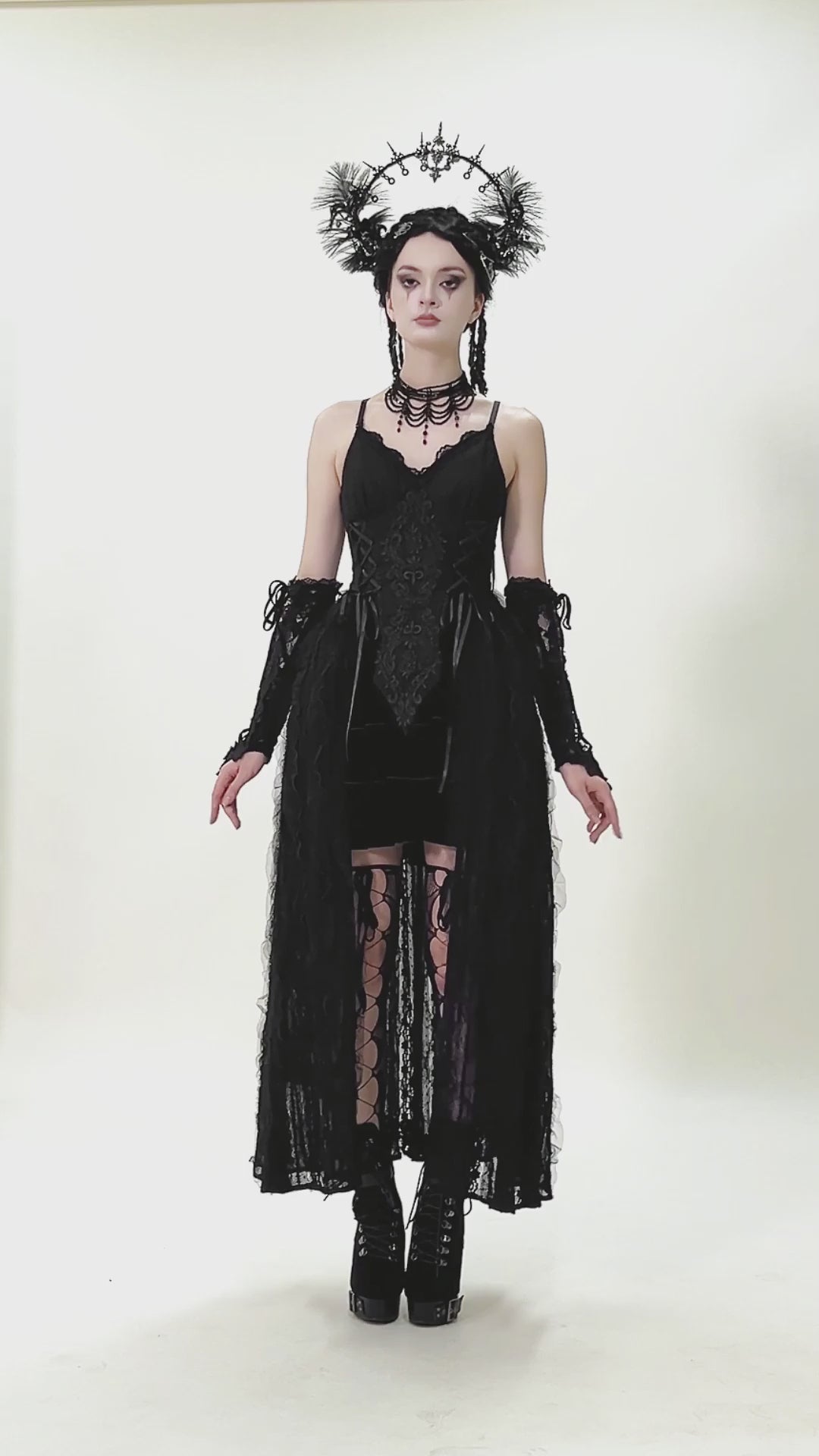 Gothic Black Lace Maxi Dress with Split Panels showcased on a model, featuring corset details and flowing lace overlay.