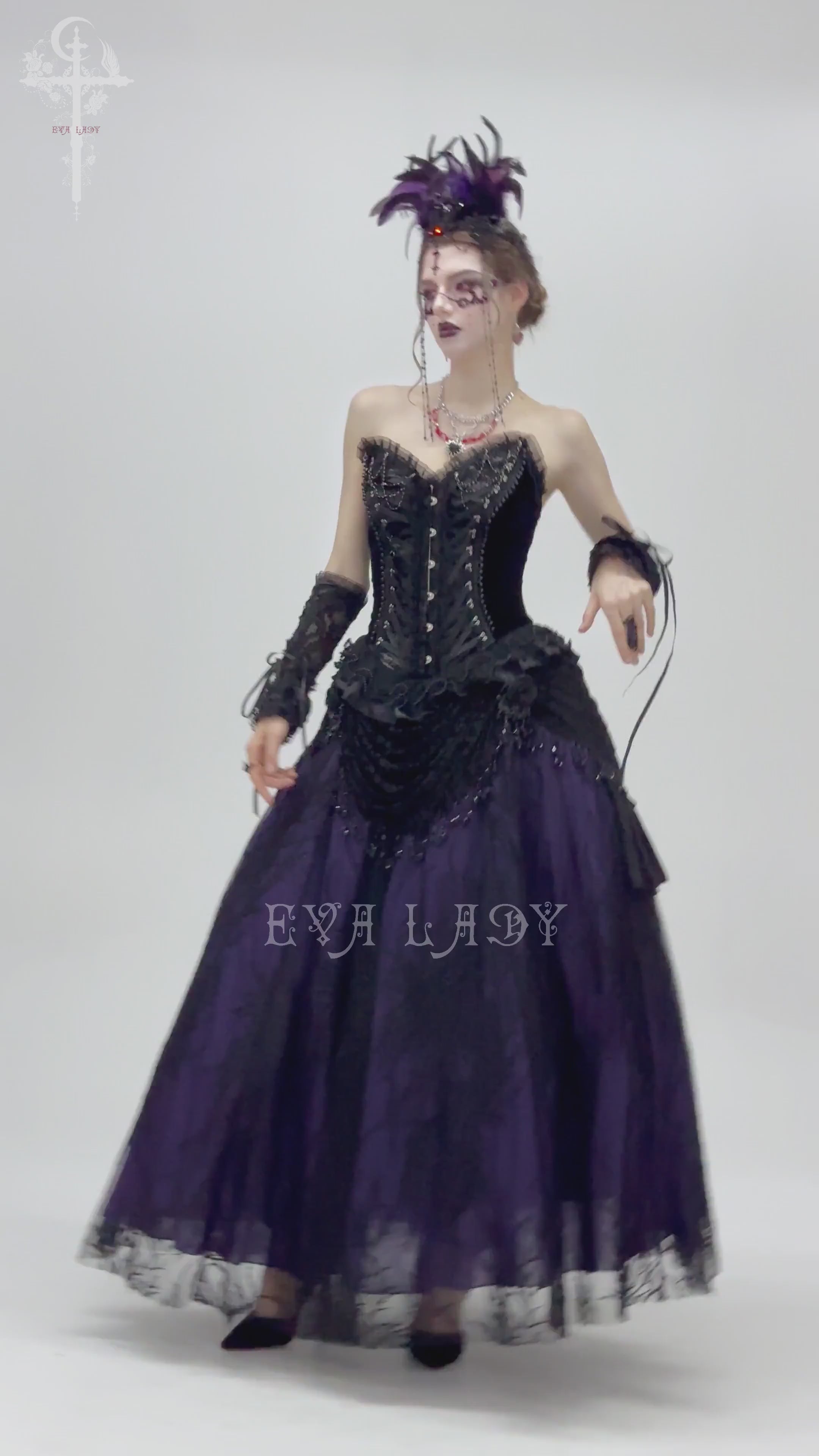 Gothic model in Victorian-style beaded skirt and corset, showcasing black and purple lace with elegant draping.