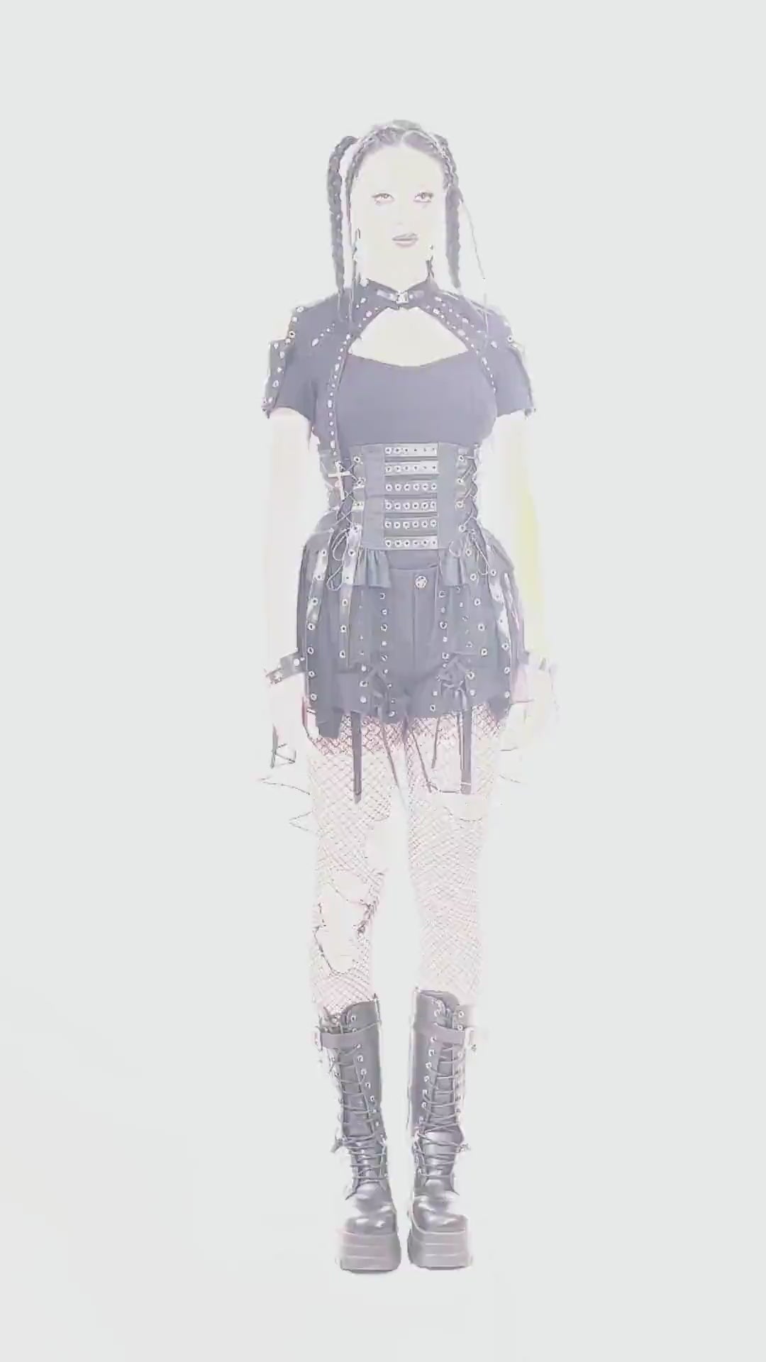 Model wearing a gothic lace-up corset belt with layered tulle skirt and bold accessories.