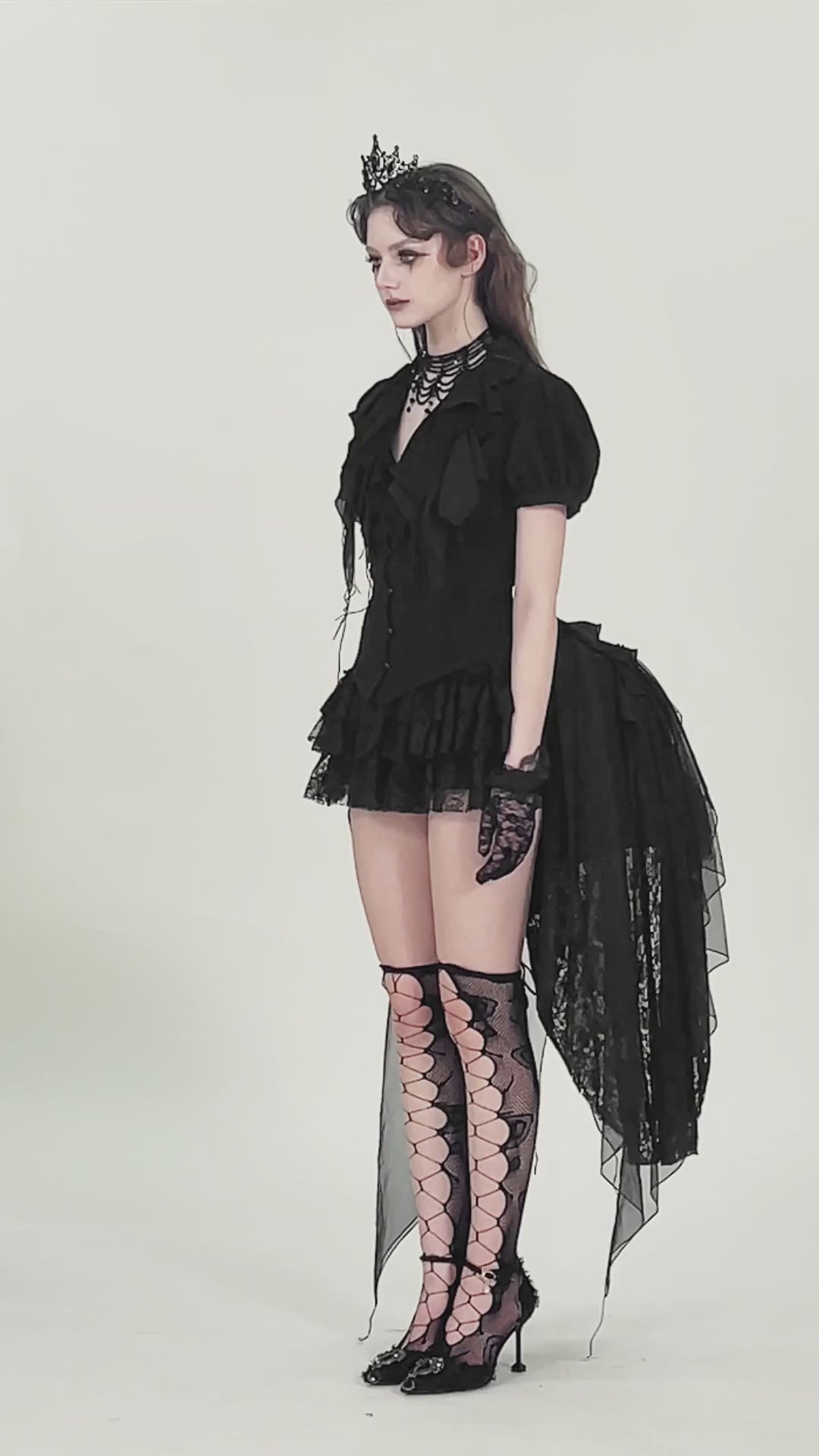 Gothic Black Ruffled Blouse with Corset Lace Back worn by a model, showcasing puff sleeves and lace details.