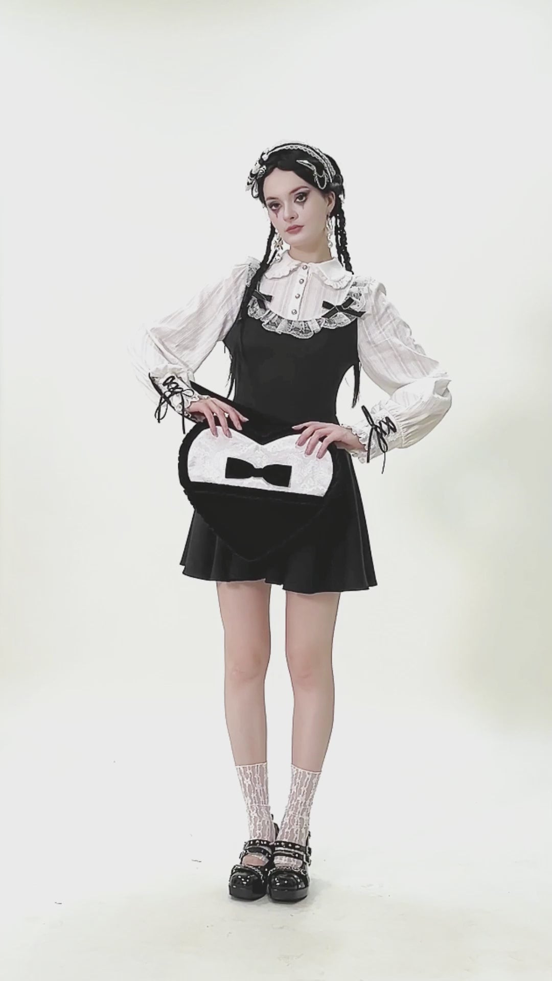 Model showcasing a Heart-Shaped Gothic Lace Bow Crossbody Bag with stylish gothic outfit and accessories.