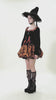 Gothic Bat Print Puff Sleeved Dress with Corset Lacing modeled with a witch hat and spooky socks.