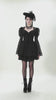 Black Lace-Up Gothic Mini Dress with Bell Sleeves worn by a model, showcasing lace details and flared sleeves.