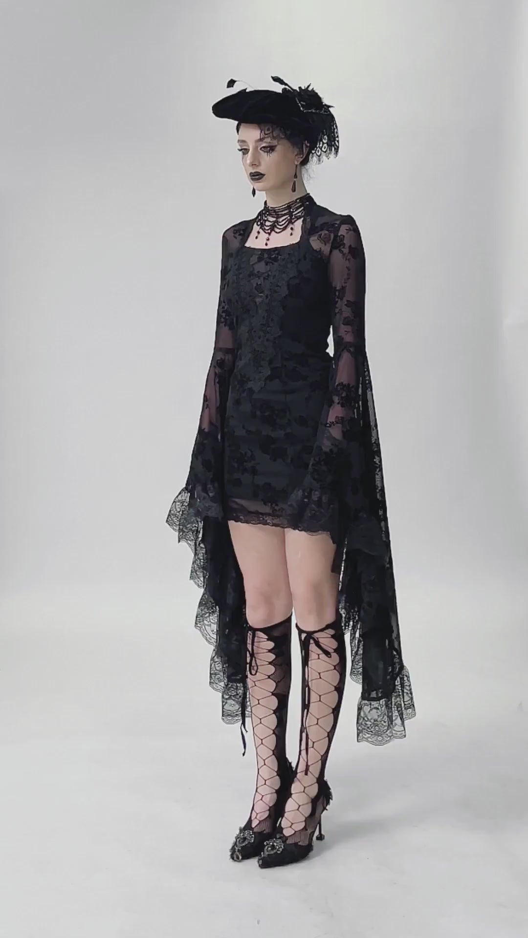 Lace Mini Dress with Bell Sleeves and Back Lace-up Design worn by model, showcasing gothic elegance and romantic allure.
