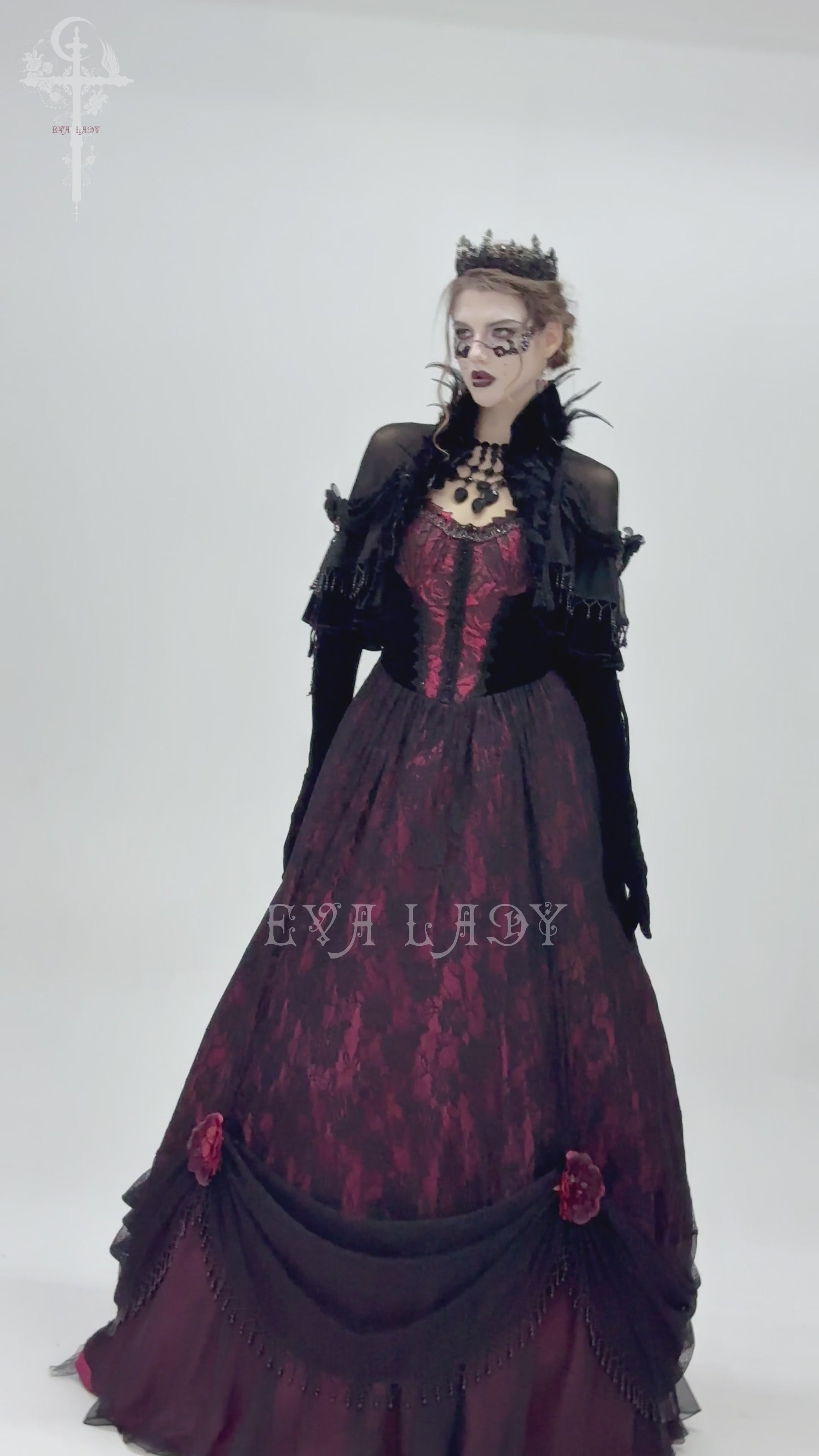 Gothic sheer mesh shrug with ruffles and feather trim over a Victorian-inspired dress, perfect for alternative fashion.