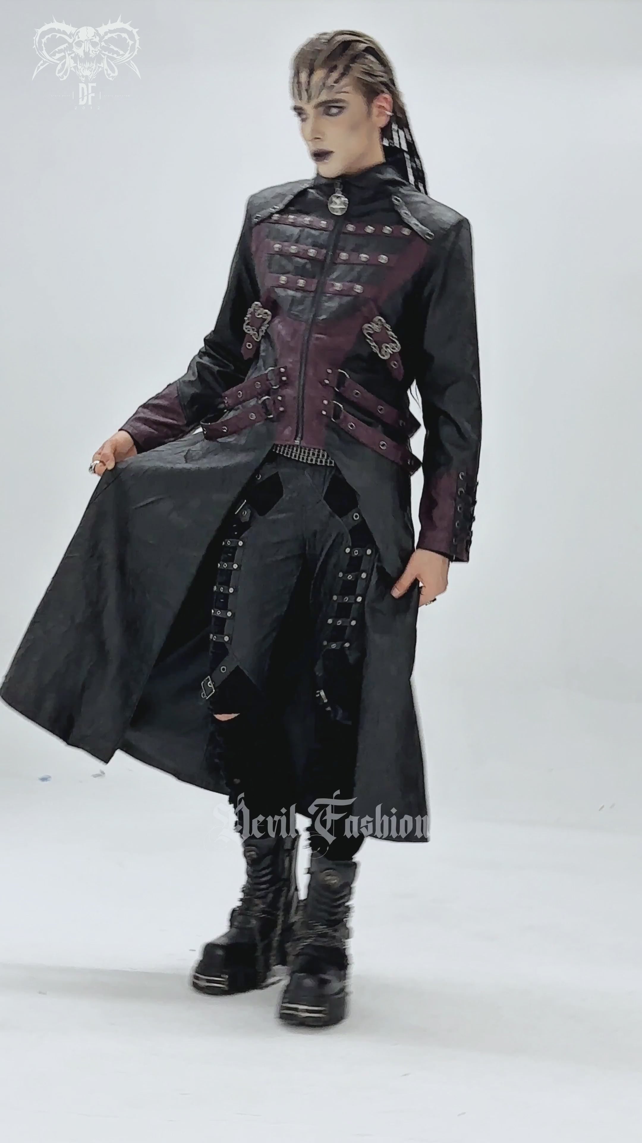 Gothic Long Coat with Buckled Panels and Metal Accents worn by a model, showcasing edgy fashion styling.