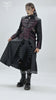 Gothic Long Coat with Buckled Panels and Metal Accents worn by a model, showcasing edgy fashion styling.