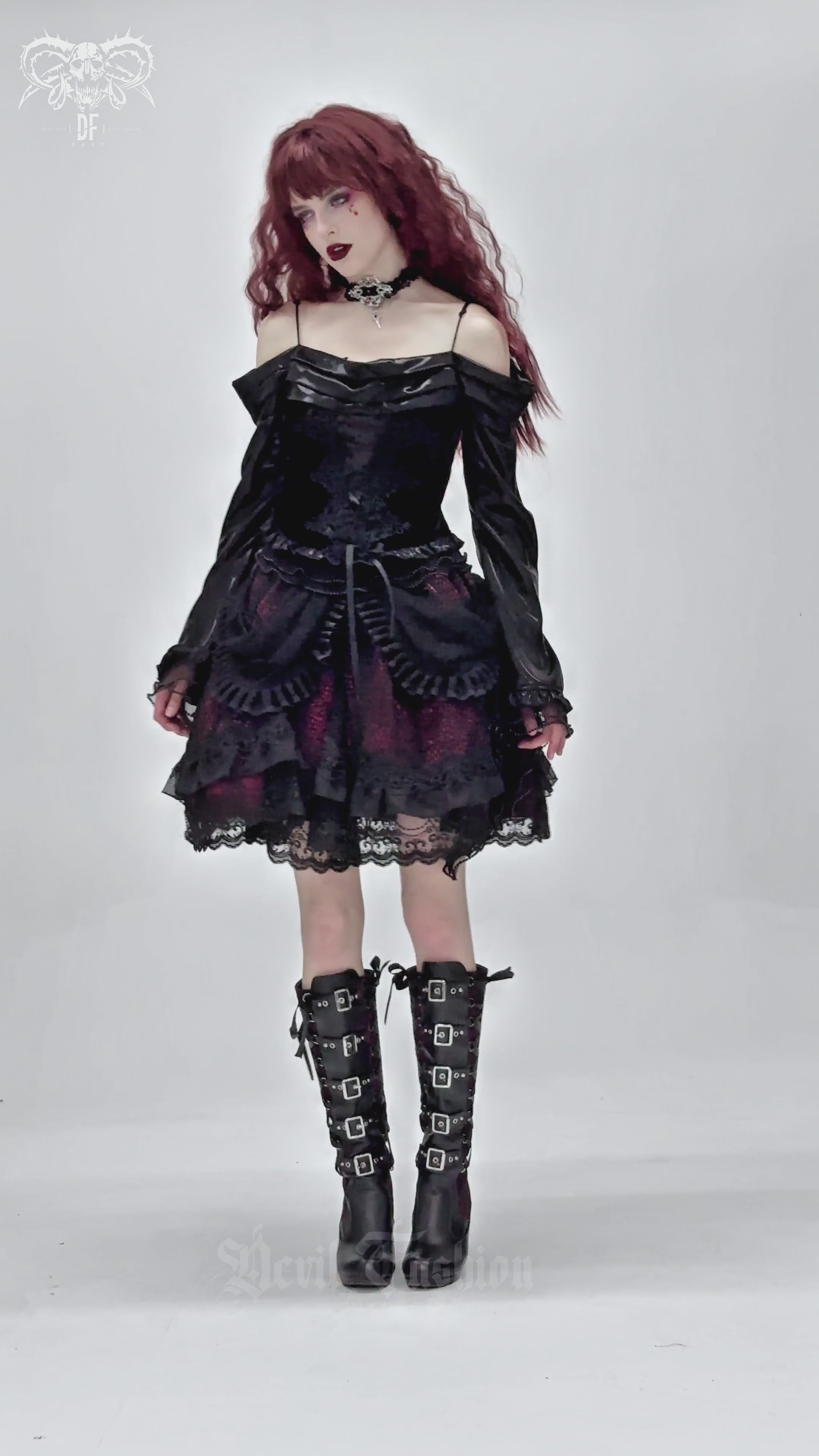 Gothic lace skirt with black ruffles, layered design, and Victorian-inspired silhouette, worn with tall boots.