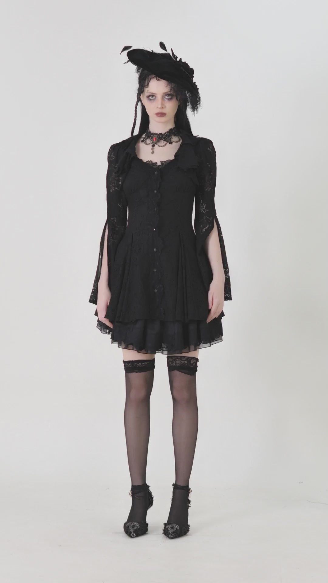 Victorian Gothic lace mini dress with corset back, featuring elegant black floral design and dramatic accessories.