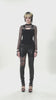 Punk Rock Black Fishnet Sleeved Top with Cutout and Straps styled with edgy leather pants.
