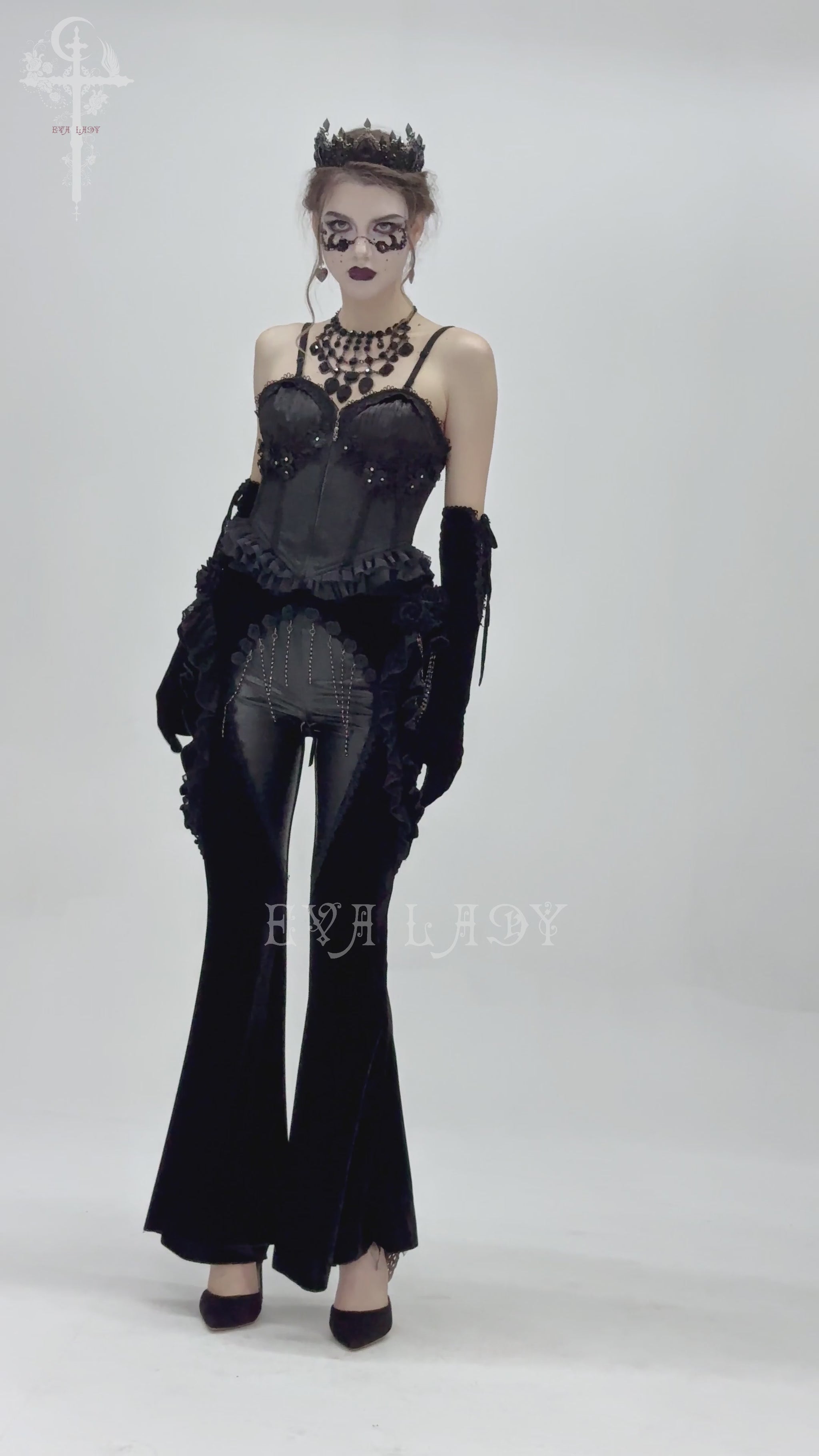 Gothic velvet and leather flare pants with lace ruffles on model, showcasing Victorian-inspired elegance.