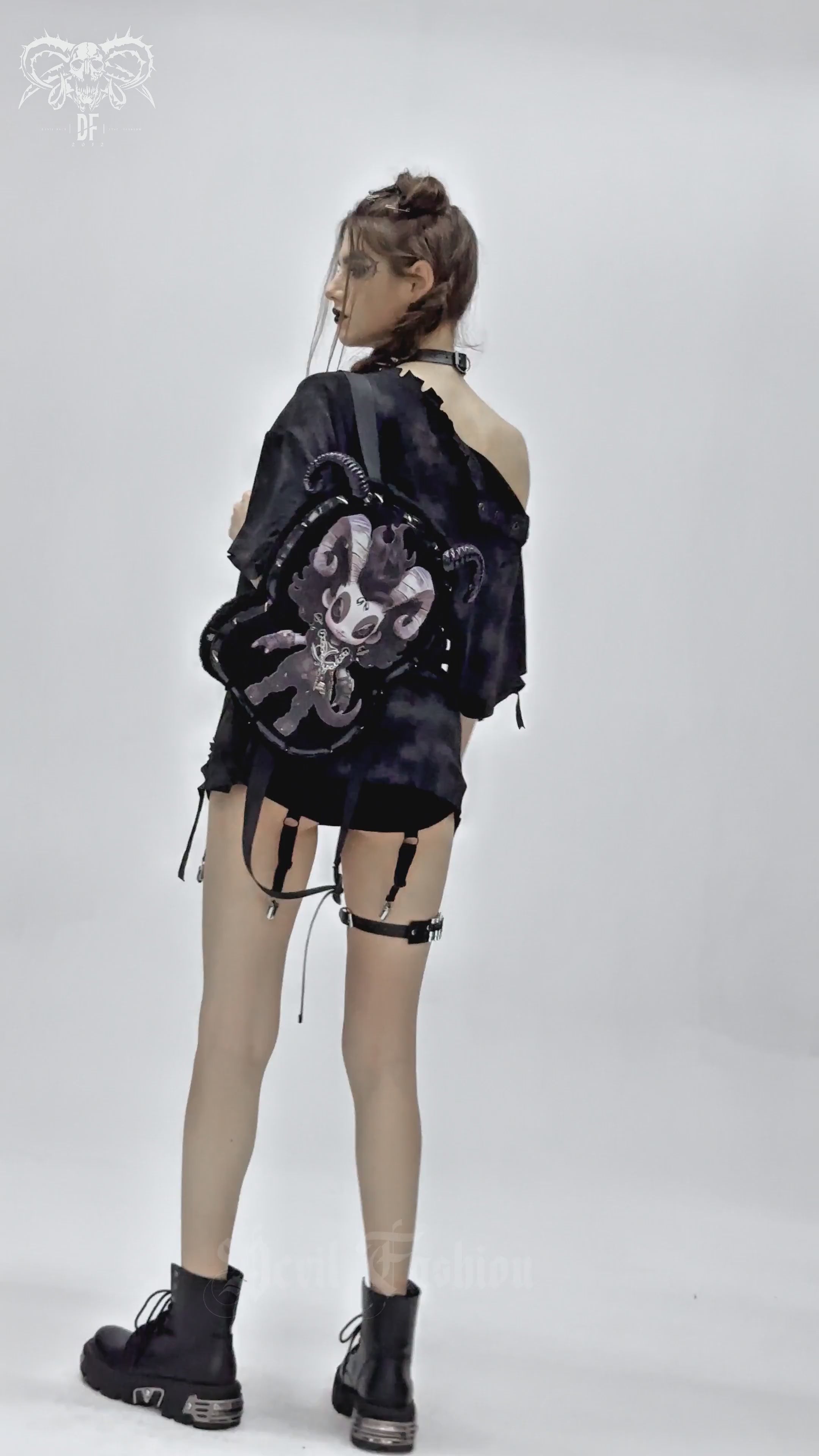 Gothic Demon Character Backpack with Horns and Spikes worn by a model showcasing an edgy alternative fashion style.