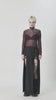 Edgy women's long-sleeved sheer mesh top in black and red, styled for a bold grunge look with a dramatic black skirt.