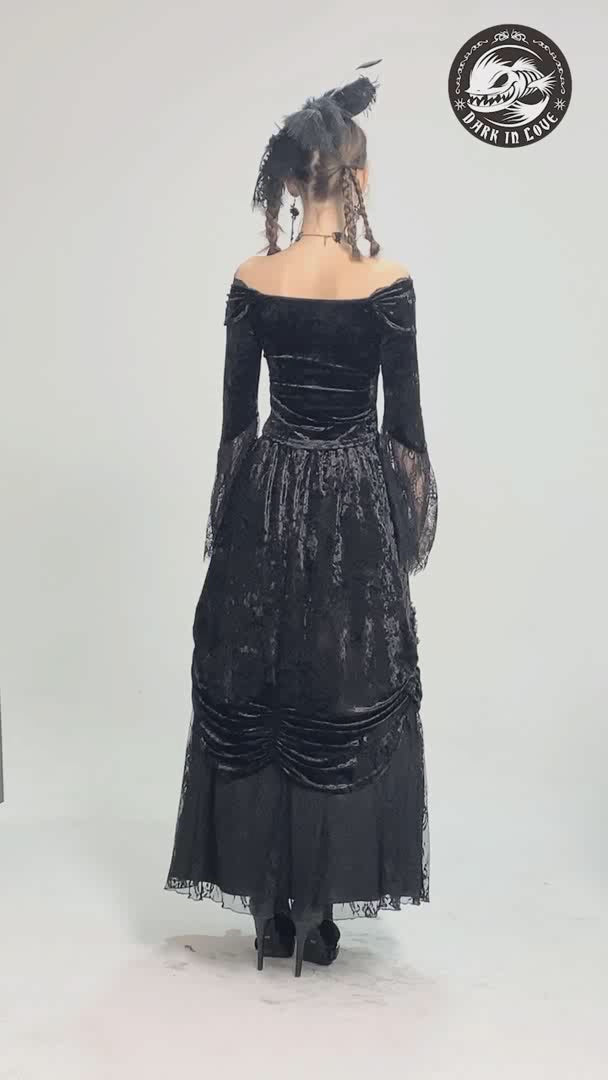 Gothic off-shoulder velvet top with flared lace sleeves, showcasing a vintage-inspired silhouette.