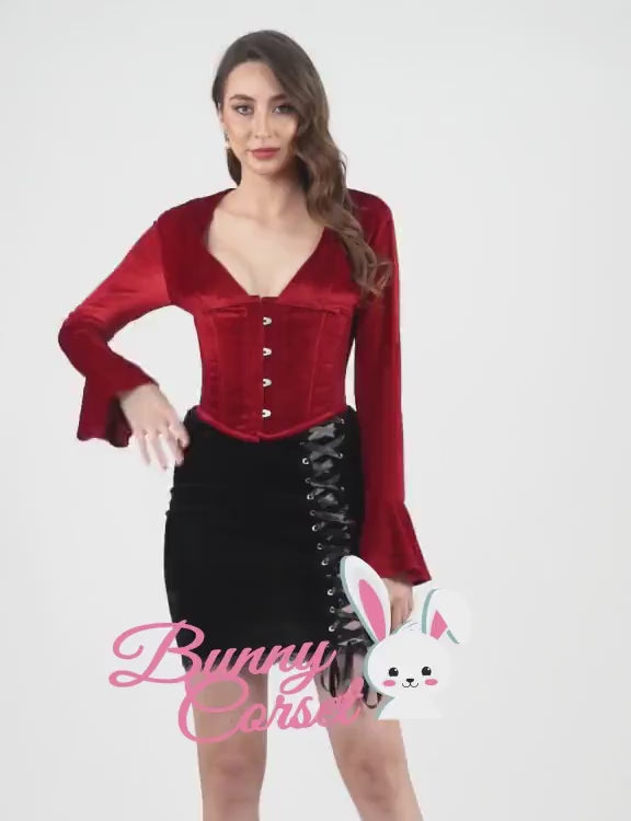 Elegant red long sleeve corset top with bell sleeves, paired with a black lace-up skirt, perfect for gothic or vintage fashion.