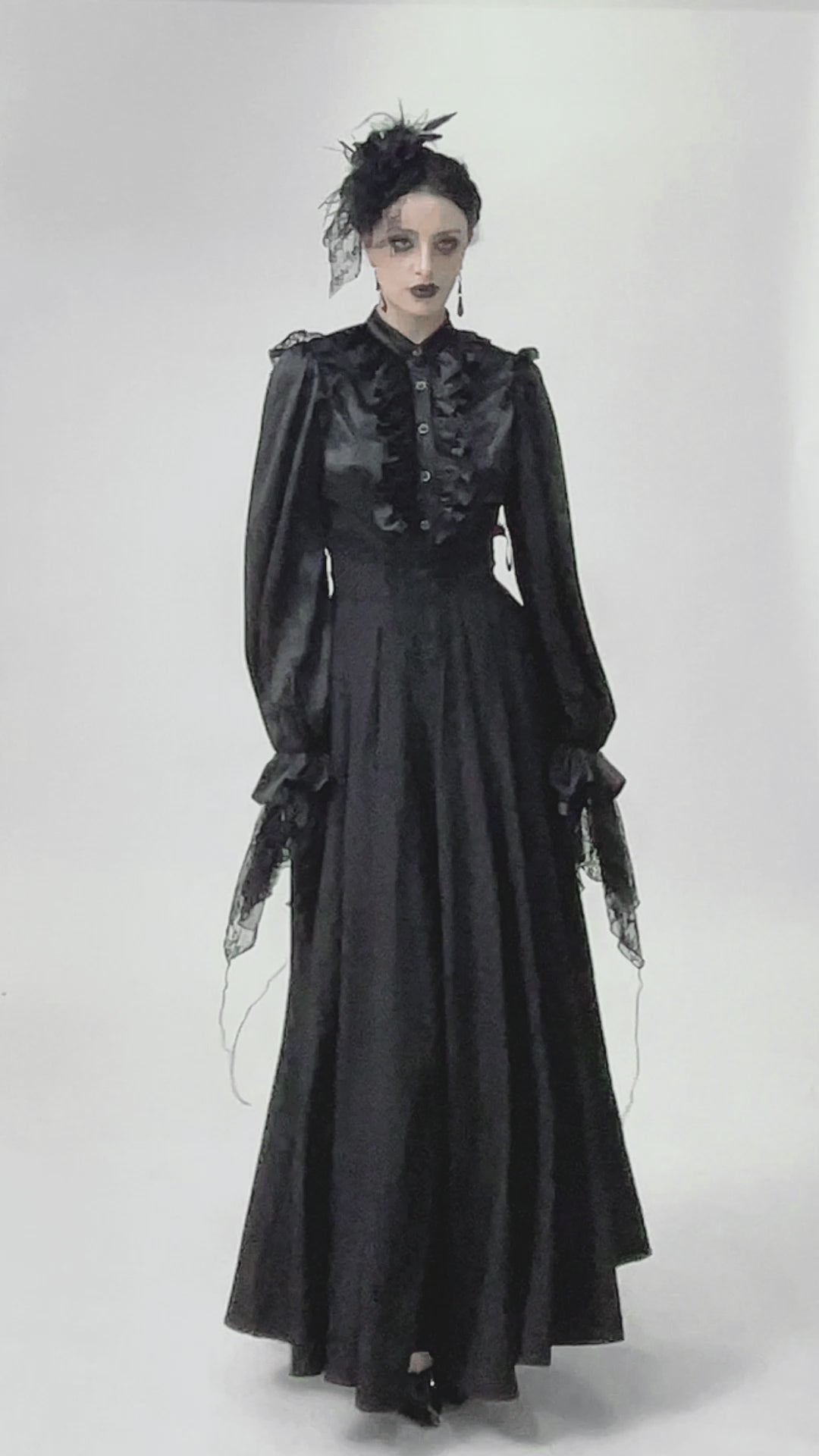Elegant Black Maxi Skirt with Lace Back and Bow Detail on a model in a gothic style.