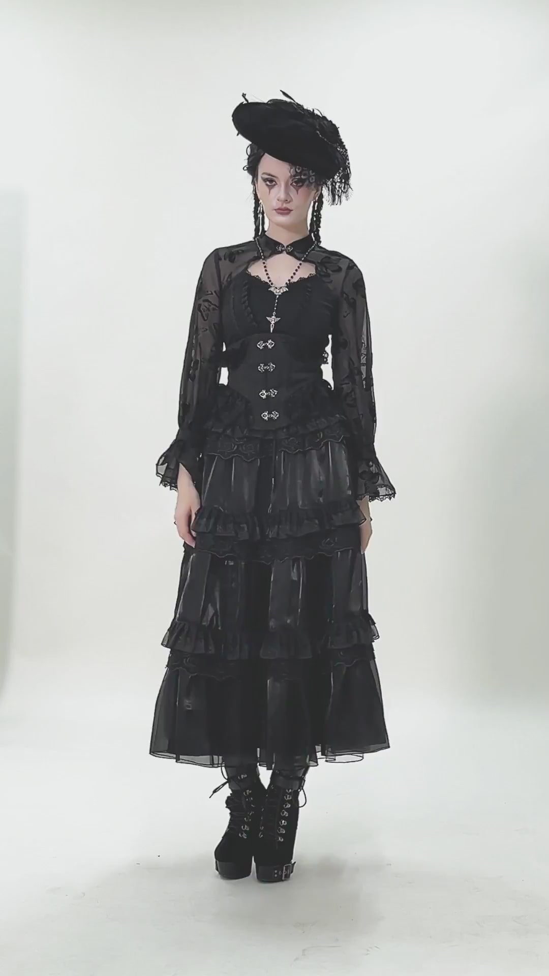 Female Layered Black Lace Mesh Skirt with Ruffled Tiers styled in gothic fashion with ruffled details and lace accents.