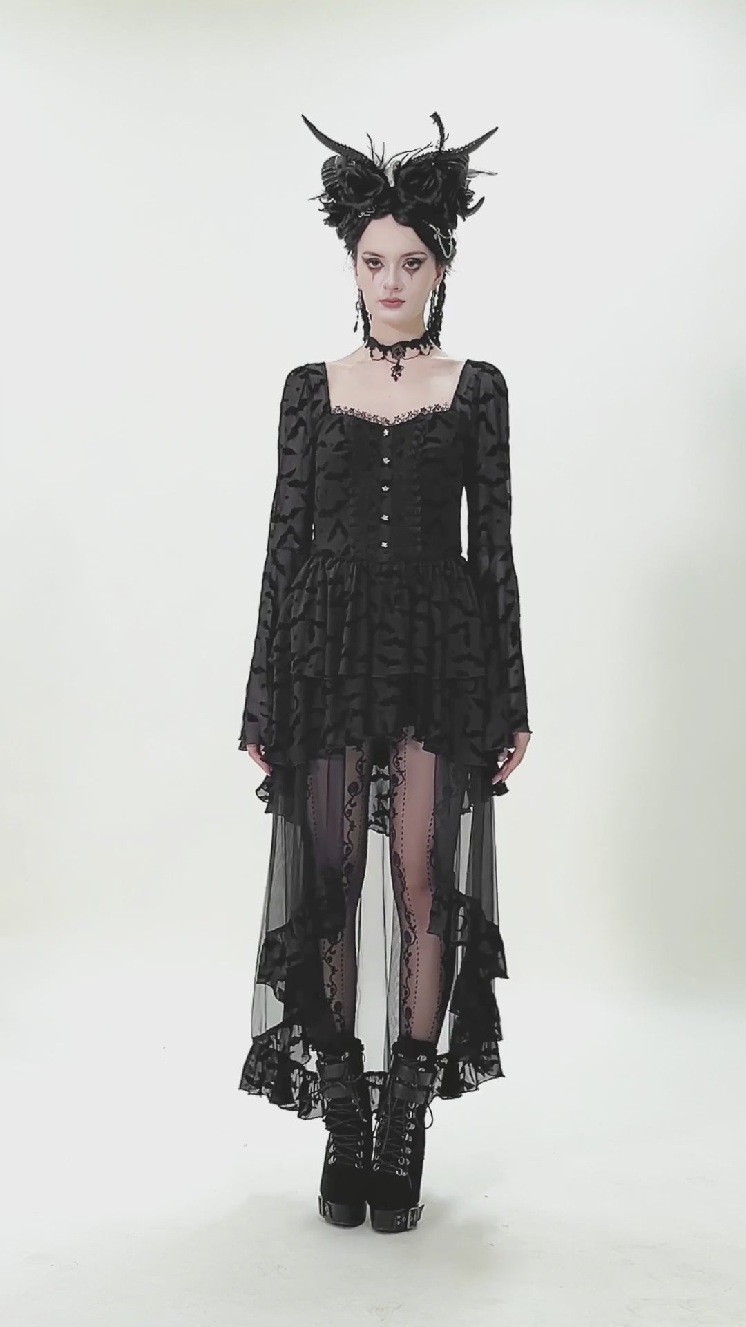 Black Gothic Bat Lace Dress with Sheer High-Low Hem worn by a model, featuring bell sleeves and lace details.