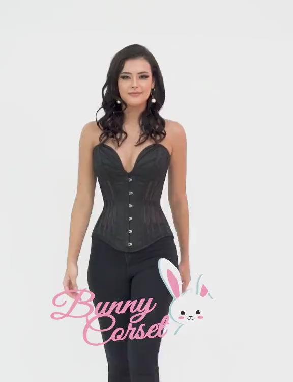 Chic black overbust corset on model, showcasing elegant design and hourglass silhouette with Bunny Corset logo.