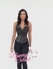 Model showcasing a stylish black PVC and mesh overbust corset, perfect for waist training and a bold fashion statement.