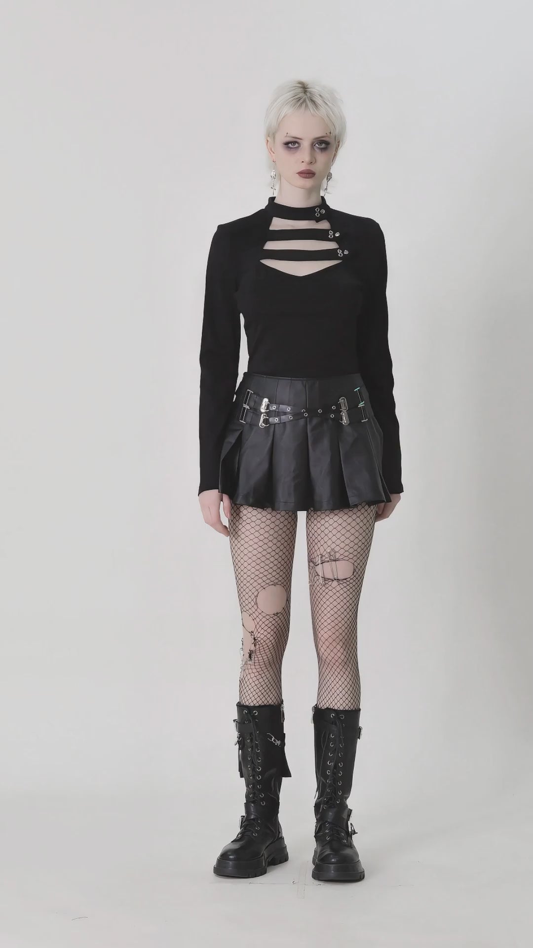 Gothic long-sleeve top with neck cutout, button detail, and stylish punk outfit, perfect for alternative fashion.