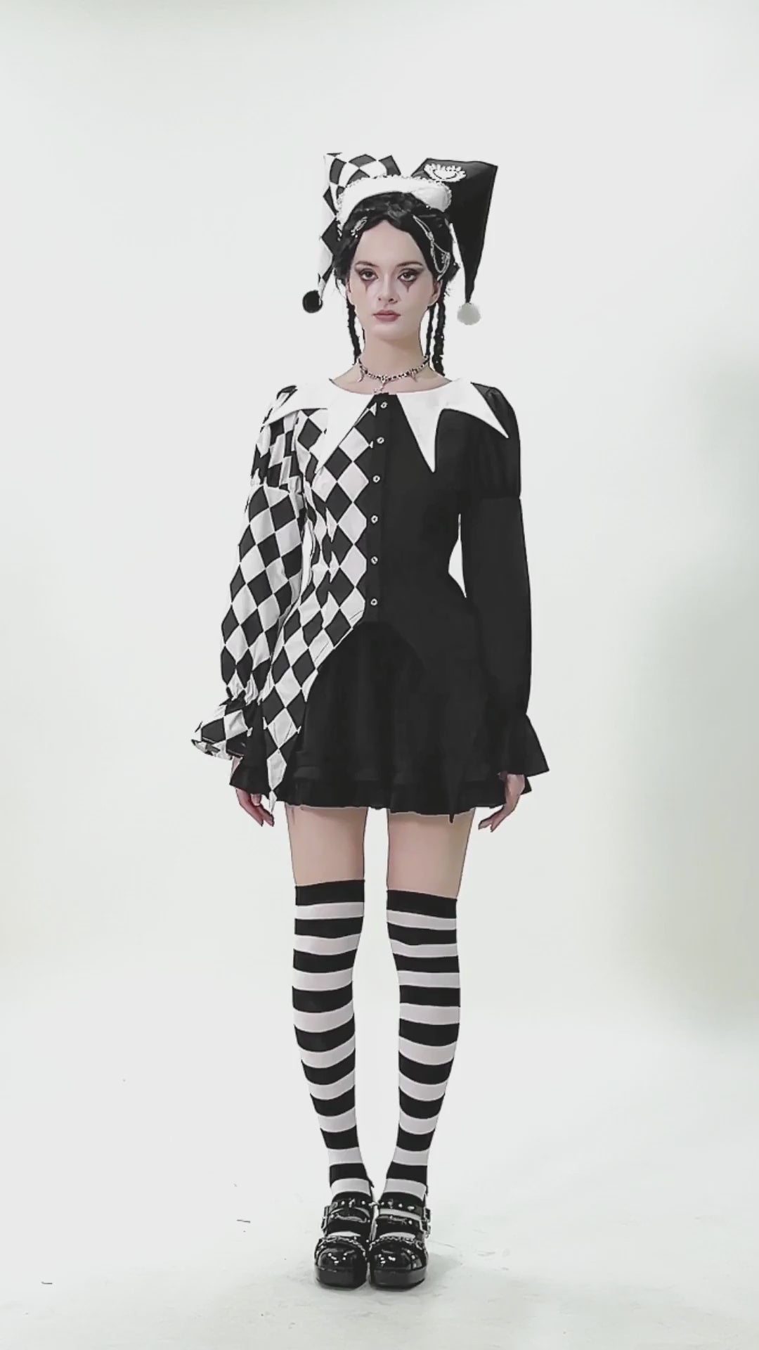 Harlequin Diamond Pattern Shirt with Front Button Detail worn with striped stockings and harlequin hat, showcasing playful elegance.