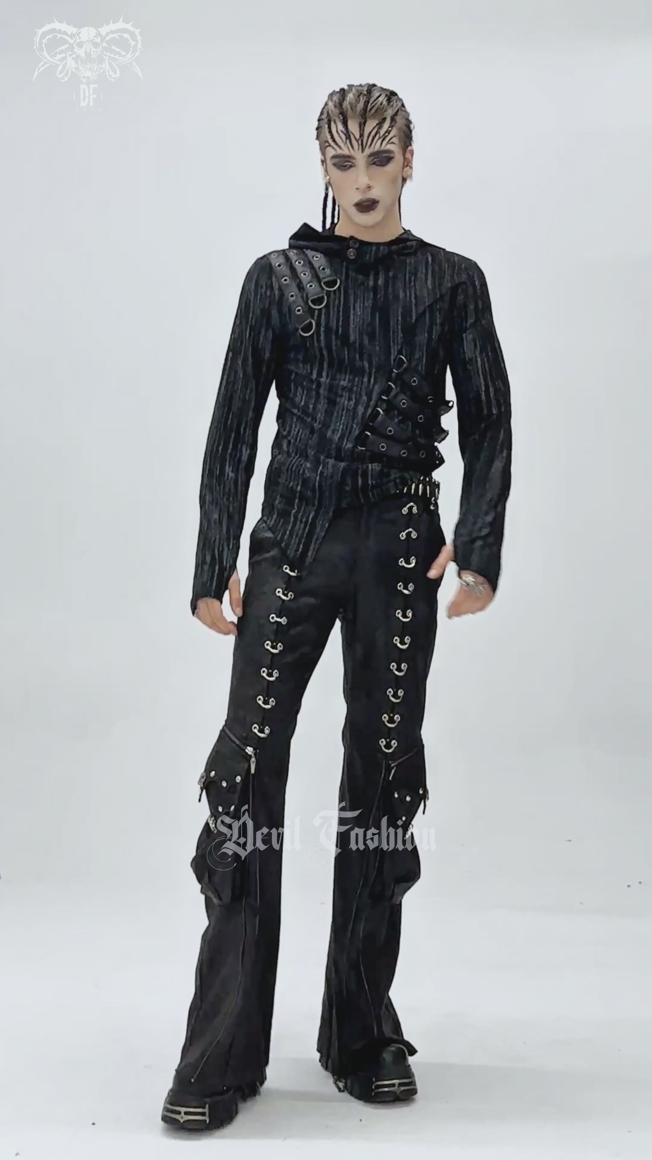 Gothic Lace Up Flared Pants with Metal Eyelet Details showcased on a model in a dramatic fashion look.