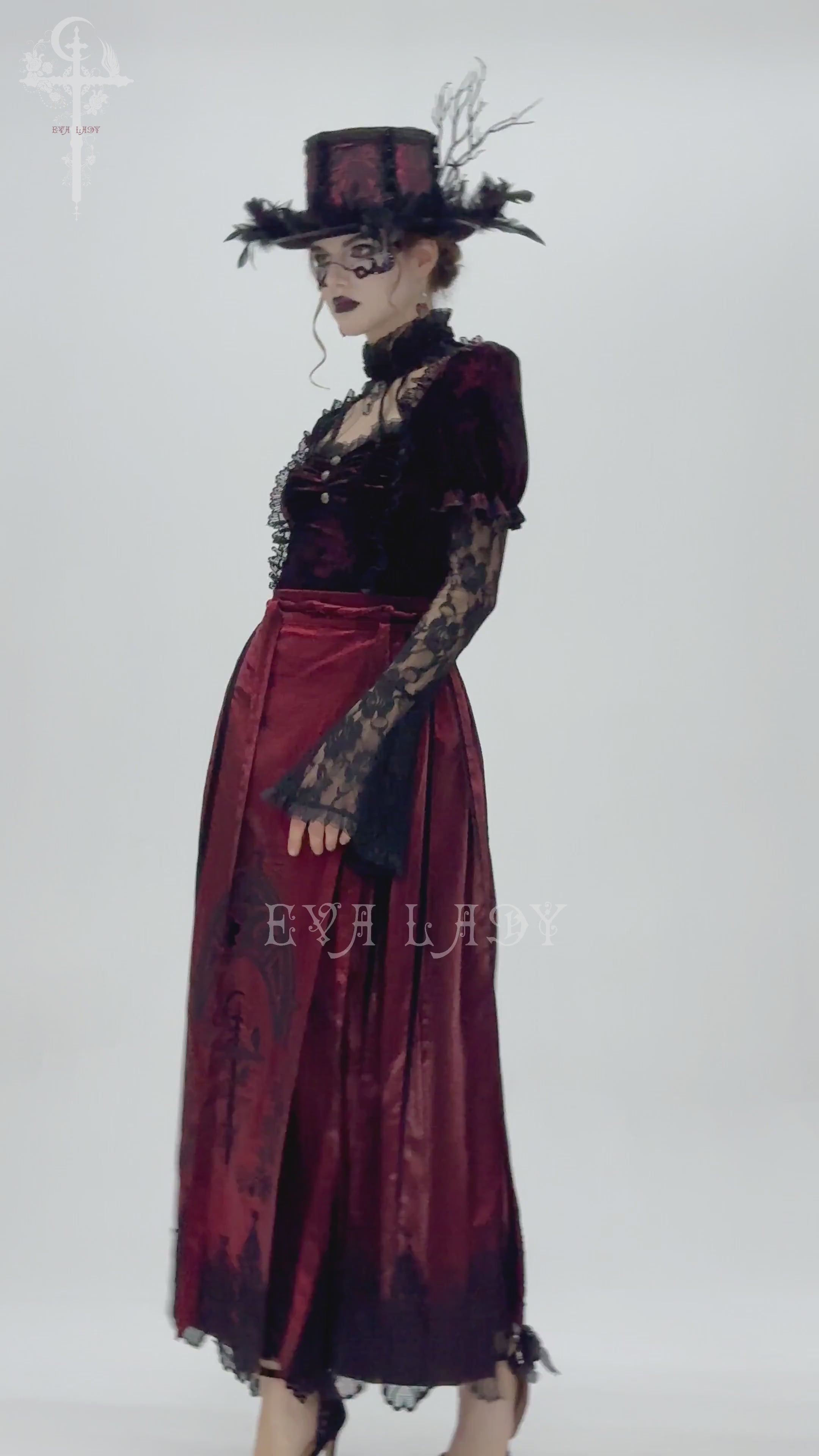 Gothic fashion model wearing a wine red maxi skirt with black lace, showcasing Victorian-inspired style and elegant detailing.