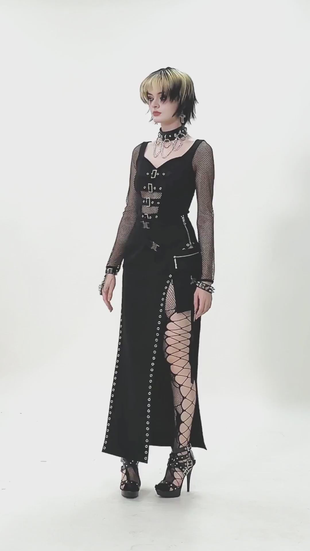 Bold Buckle Strap Maxi Skirt with Slit and Metal Trim worn by model, showcasing punk and goth style.