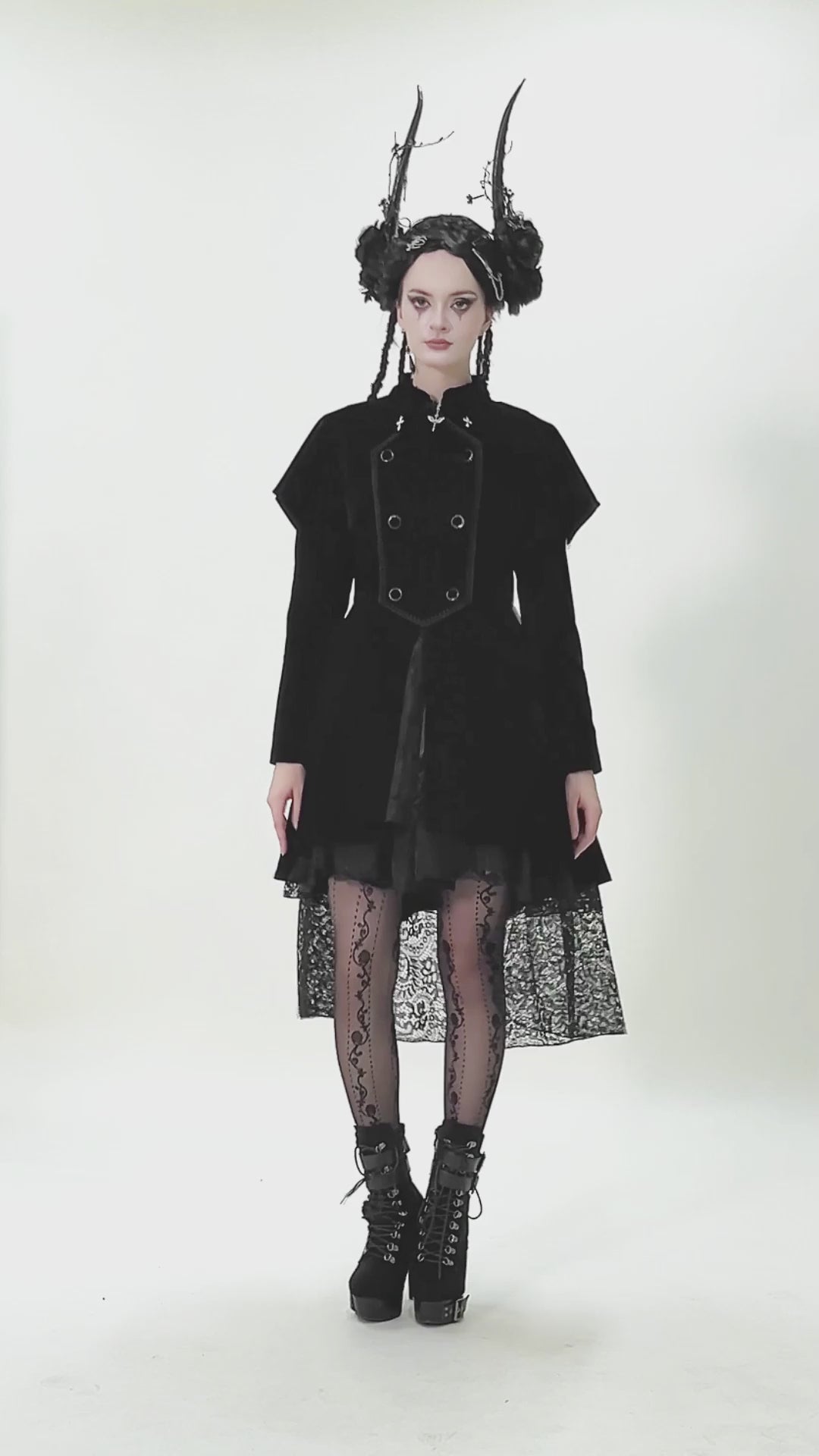 Gothic Bat-Winged Velvet Coat with Cross Collar Detail showcased by a model in a dramatic pose with unique accessories.