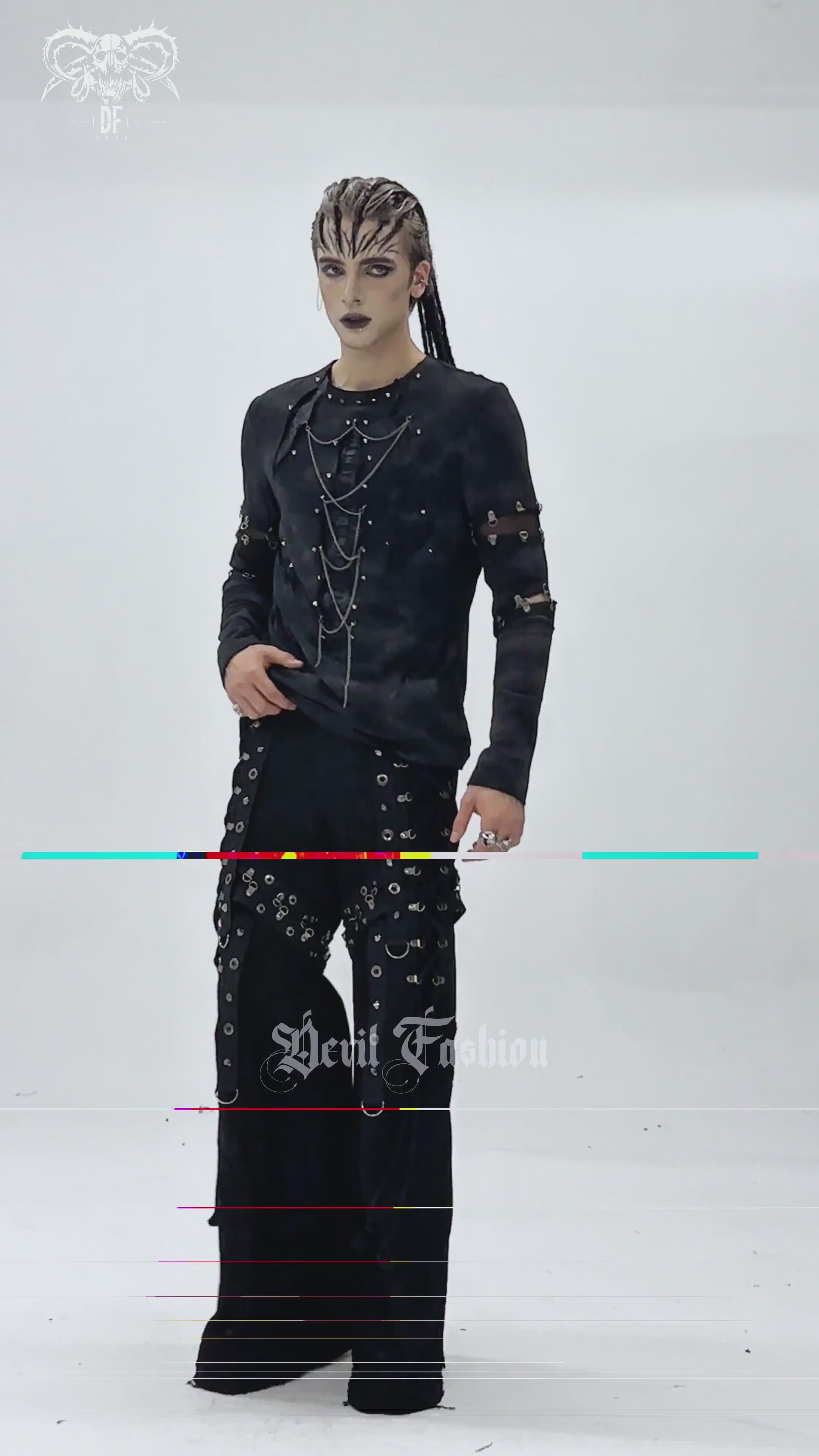 Gothic Long Sleeve Top with Chains and Cutout Design worn by model, featuring distressed fabric and stud accents.