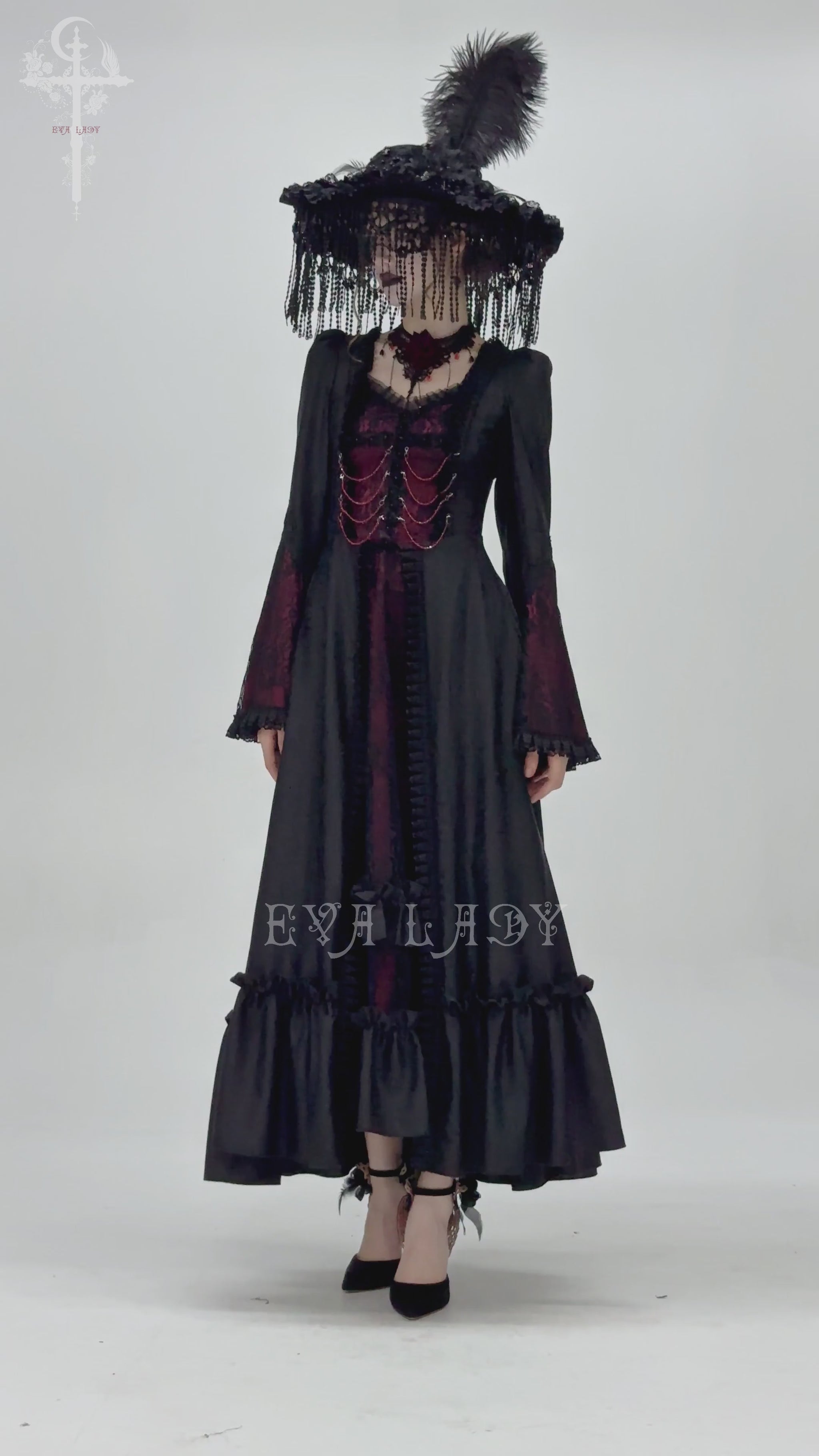 Gothic long black and wine red lace maxi gown with flared sleeves and dramatic ruffled hem.
