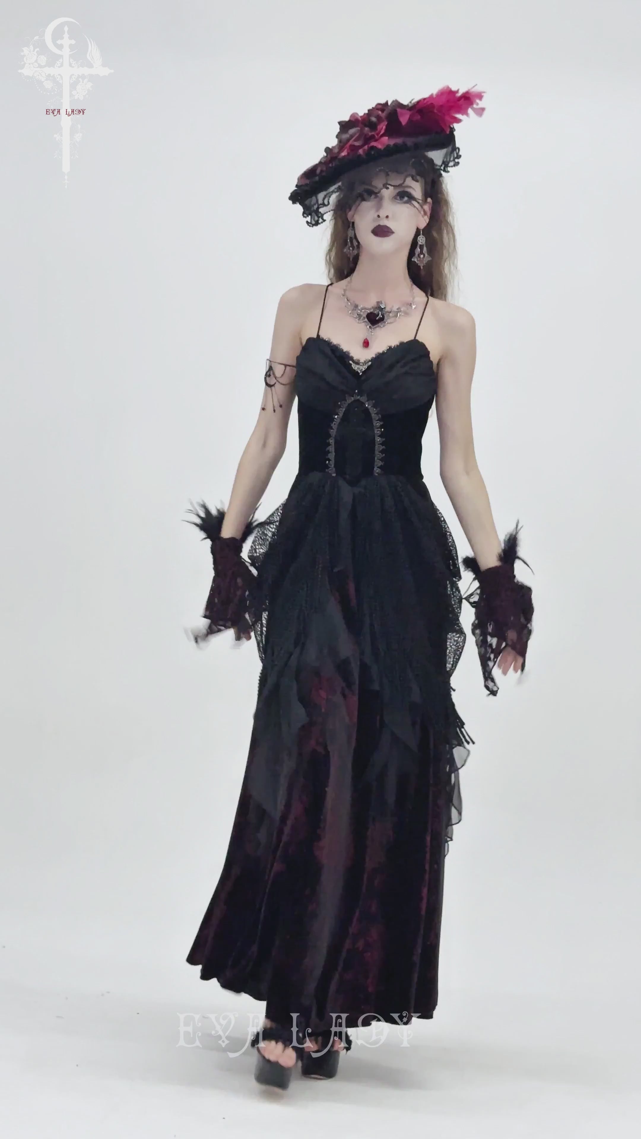 Female Gothic Lace-Up Dress with Ruffled Tulle Layers worn by a model in a vintage-inspired setting.