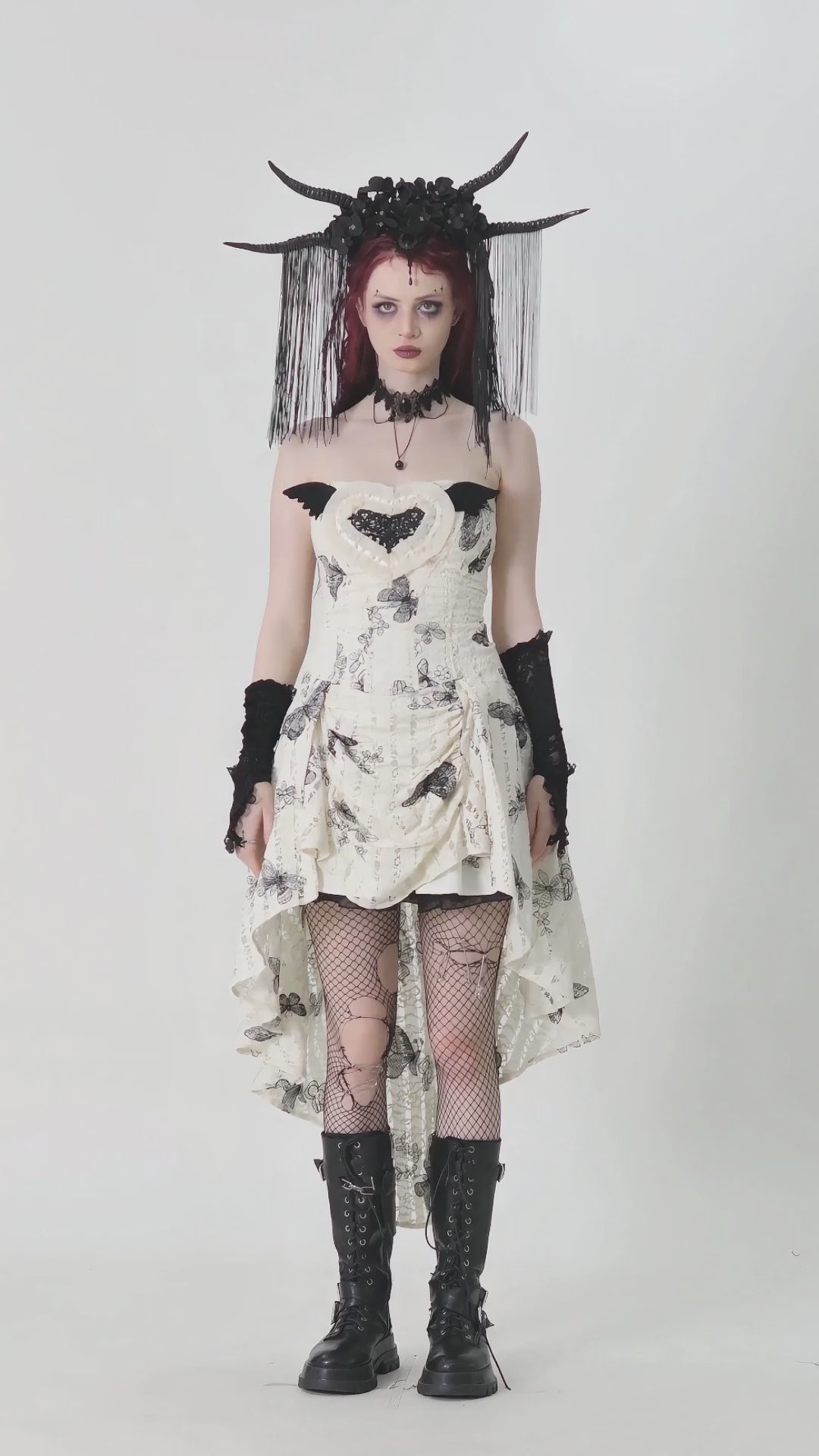 Gothic butterfly print lace dress with off-shoulder design and dramatic accessories, showcasing edgy alternative style.