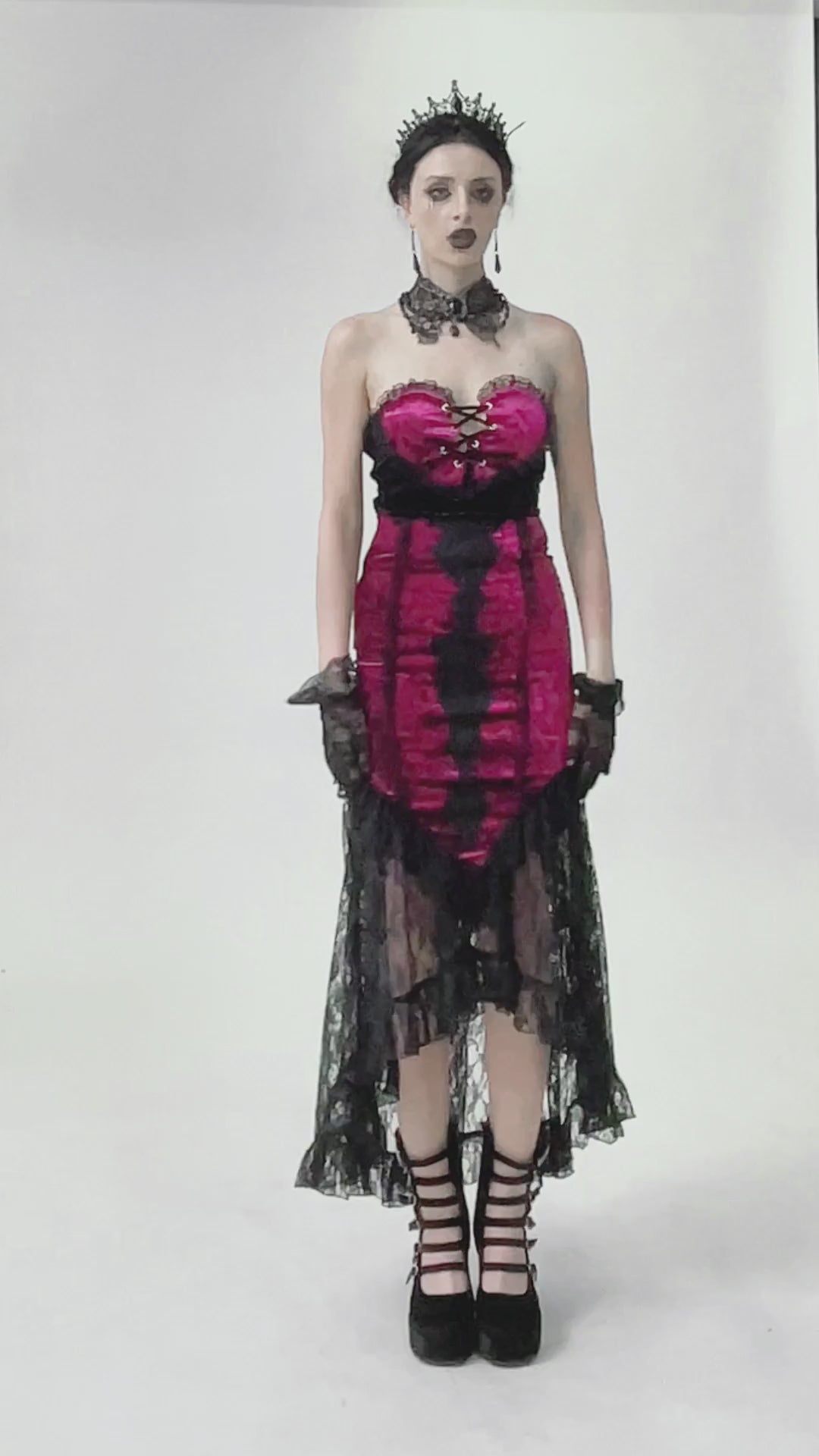 Model wearing a Gothic high-low skirt in burgundy and black lace, perfect for vampire cosplay and alternative fashion.