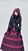 Gothic black female jacket with faux fur trim, buckle straps, and layered pink skirt for alternative fashion.