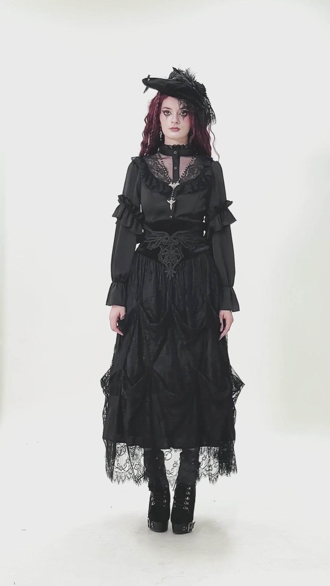 Gothic Lace Ruffle Black Blouse with Button Closure worn by a model with dramatic ruffles and lace accents.