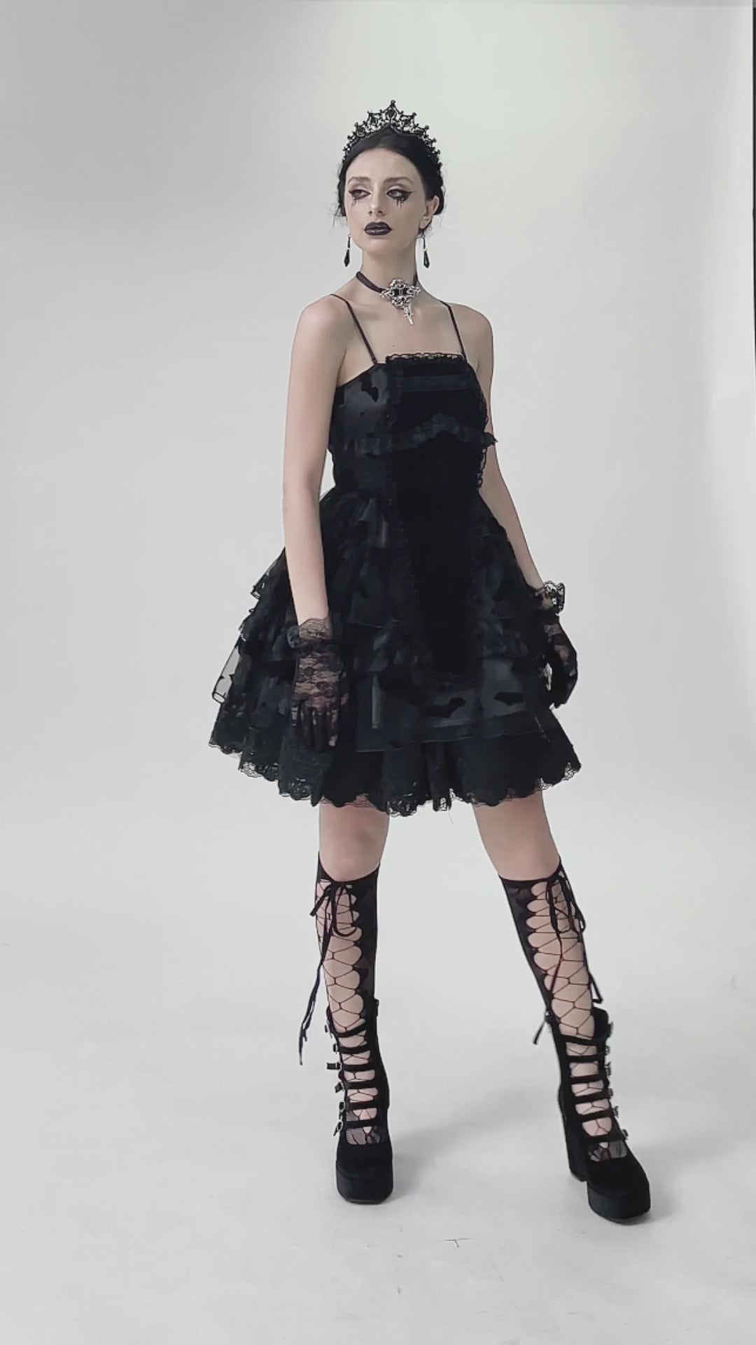 Black lace ruffled gothic dress with bat print, lace-up details, and adjustable straps for a customizable fit.