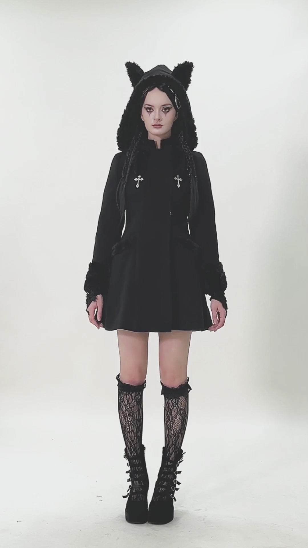 Gothic Coat with Plush Faux Fur Cuffs and Cat Ear Hood worn by a model, featuring cat ears, cross pendants, and an A-line silhouette