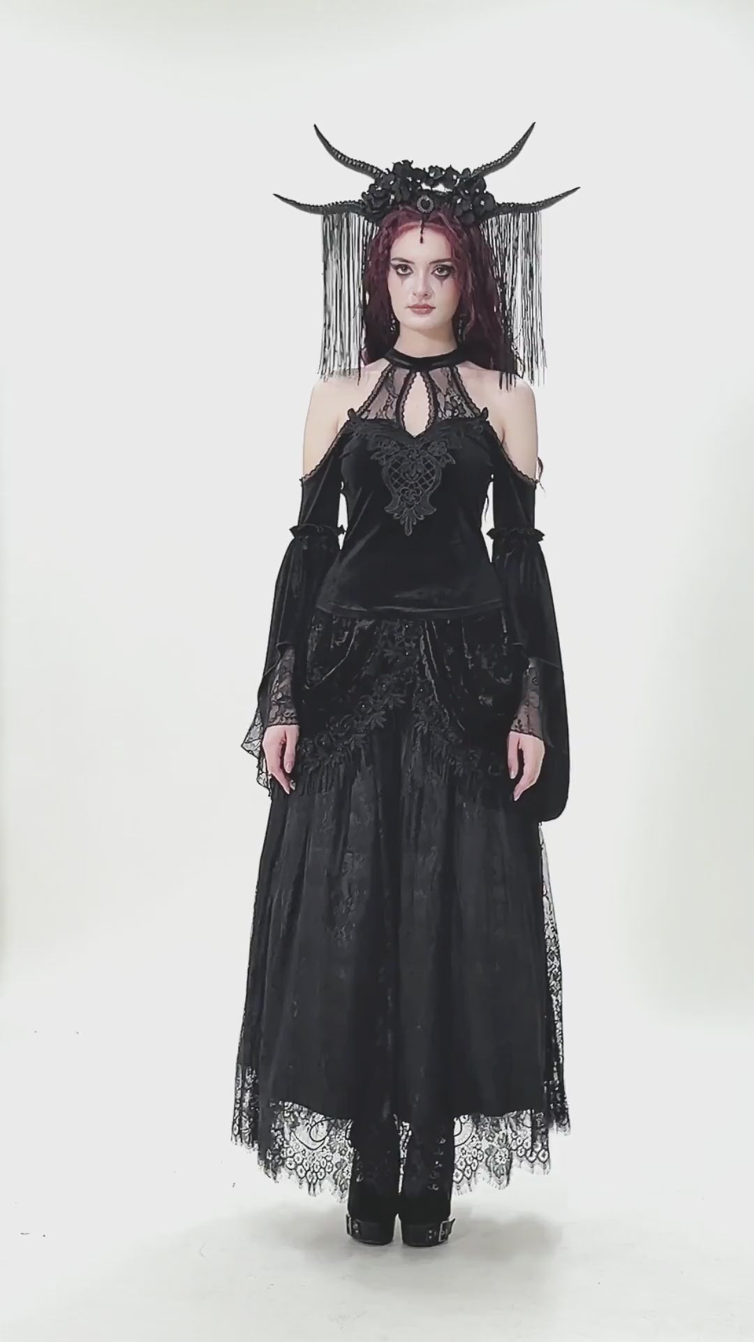 Edgy Lace Off-Shoulder Gothic Top with Dramatic Sleeves worn by a model, featuring intricate lace and dramatic bell sleeves.