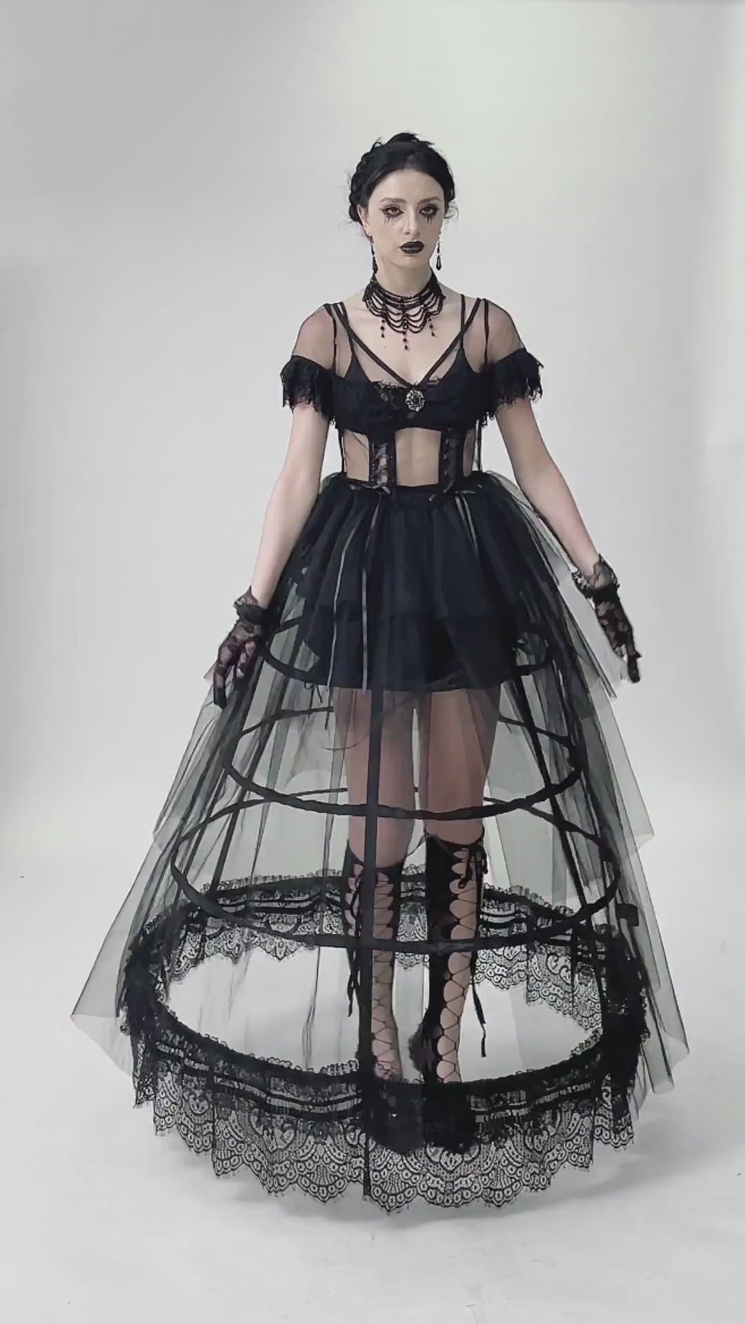 Elegant black gothic dress with lace details and layered tulle skirt, perfect for evening wear.