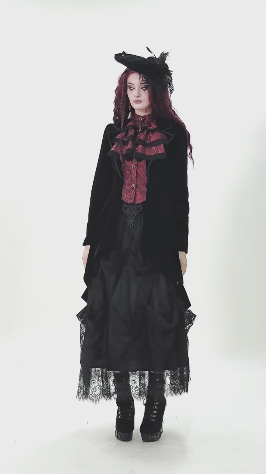 Gothic Velvet Tailcoat with Wine Red Ruffled Shirt Insert worn with a full skirt and stylish hat, showcasing dark elegance.
