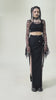 Model wearing a Black Fishnet Mesh Off-Shoulder Gothic Crop Top paired with a long black skirt and edgy accessories.