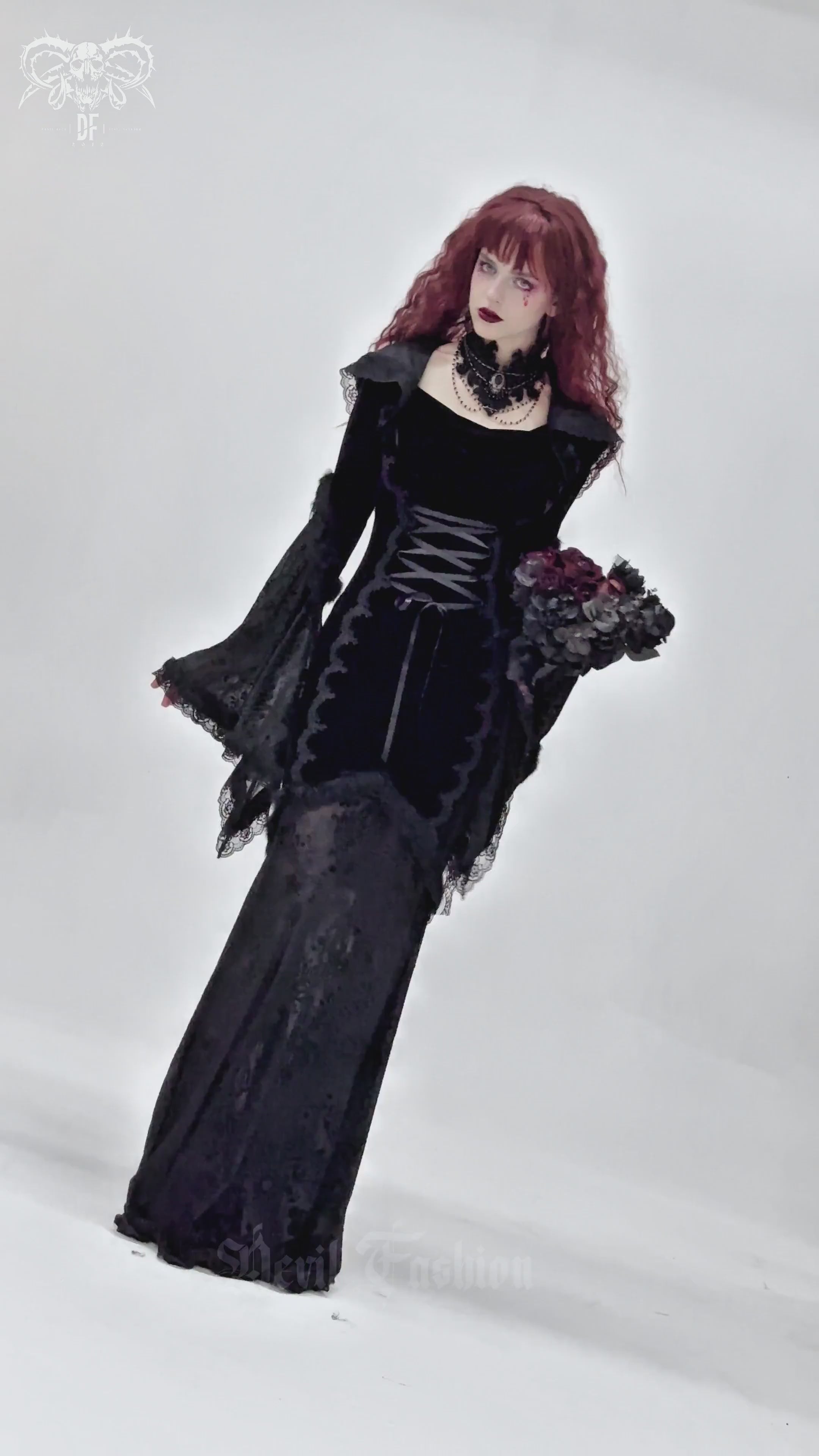 Gothic black velvet dress with hood, corset details, and lace trim, perfect for witchy outfits and special occasions.